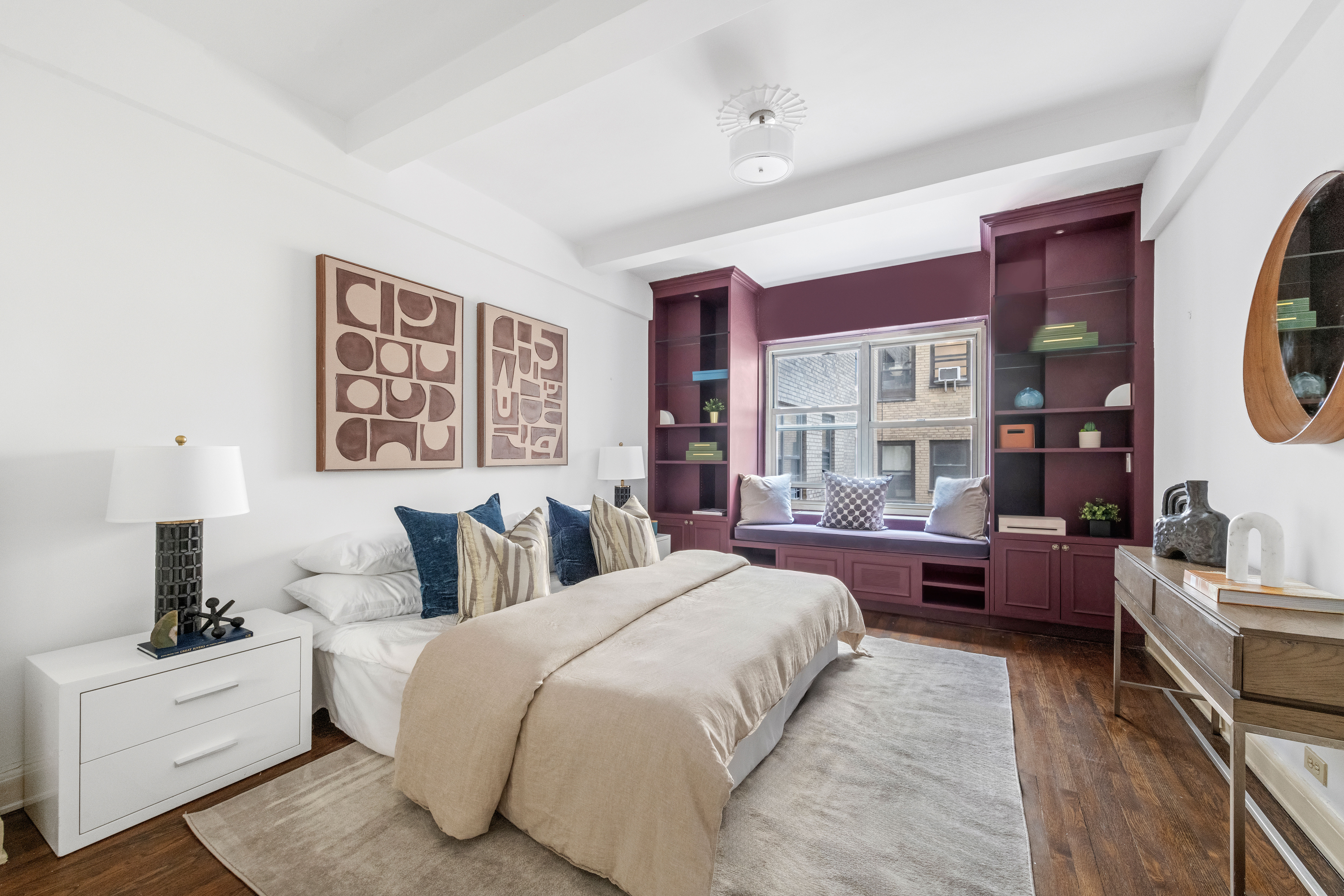 400 East 52nd Street, Unit 6K Manhattan, NY 10022 - Photo 6 of 8 a spacious bedroom with a bed and a couch