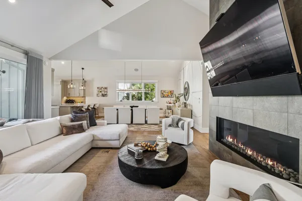 a bedroom with a bed and a large mirror