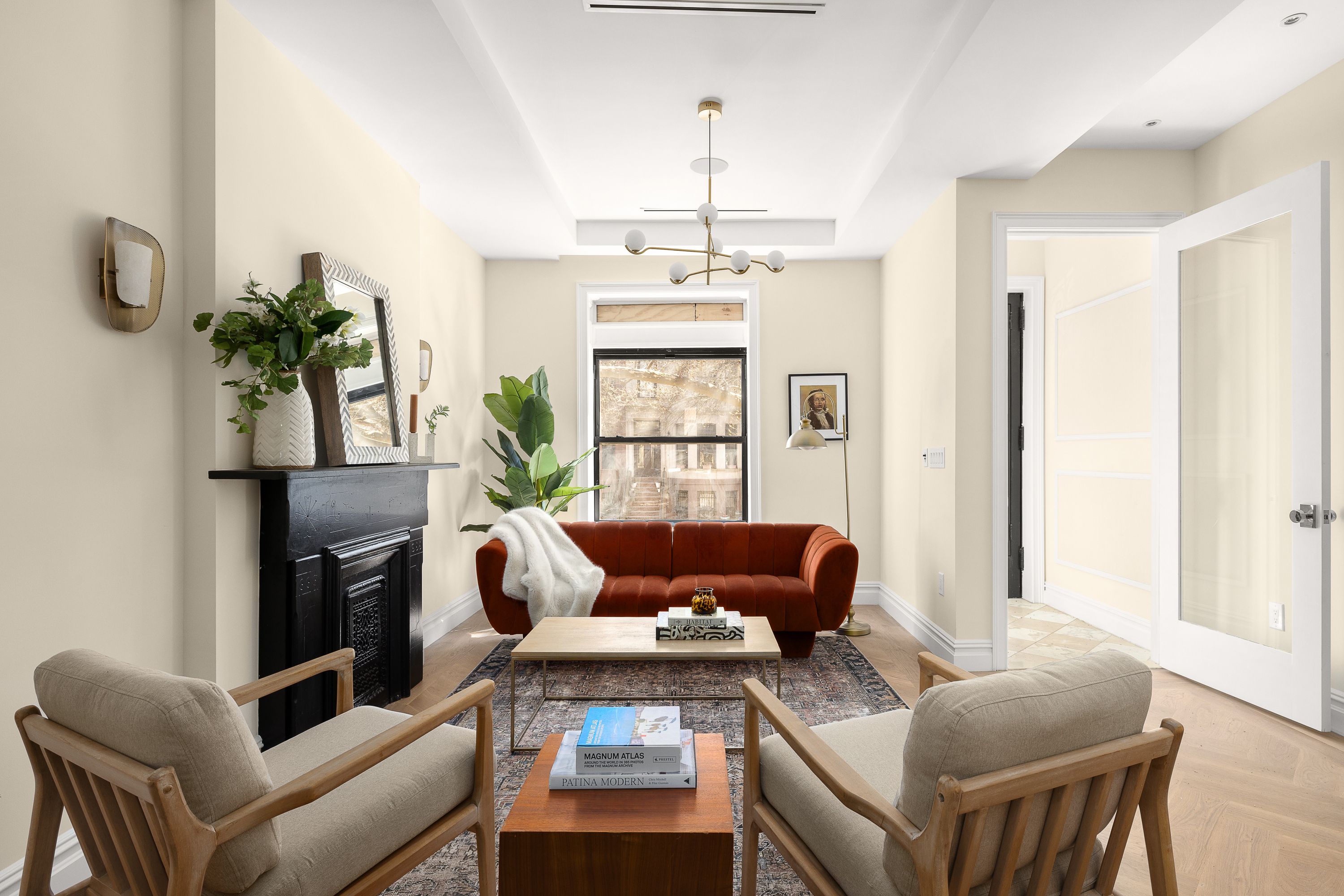 a living room with furniture fireplace and a table