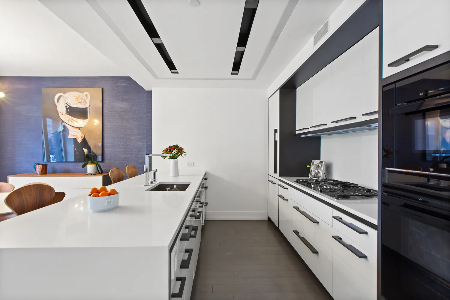a kitchen with a sink and stove top oven