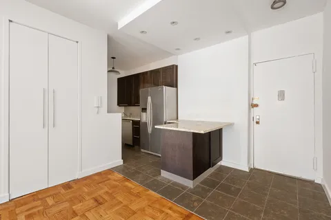 a kitchen with stainless steel appliances a refrigerator and a stove