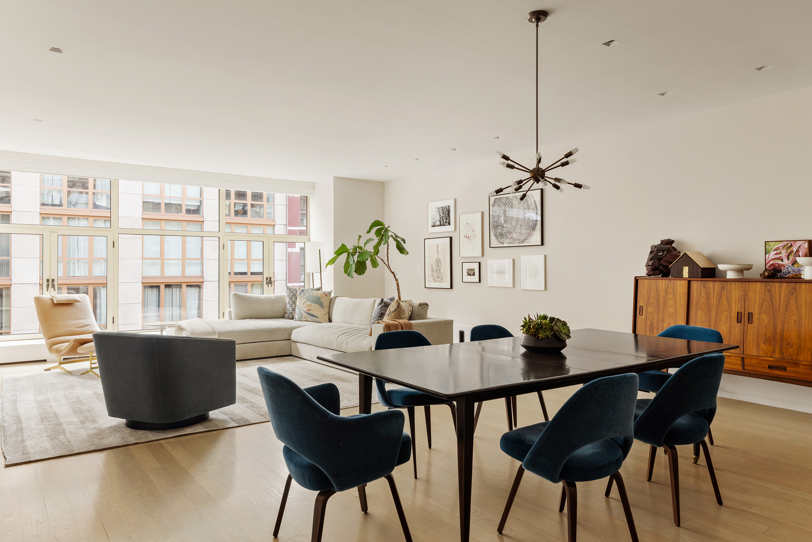 129 West 20th Street, Unit 4B Manhattan, NY 10011 - Photo 2 of 16 a dining room with furniture and window
