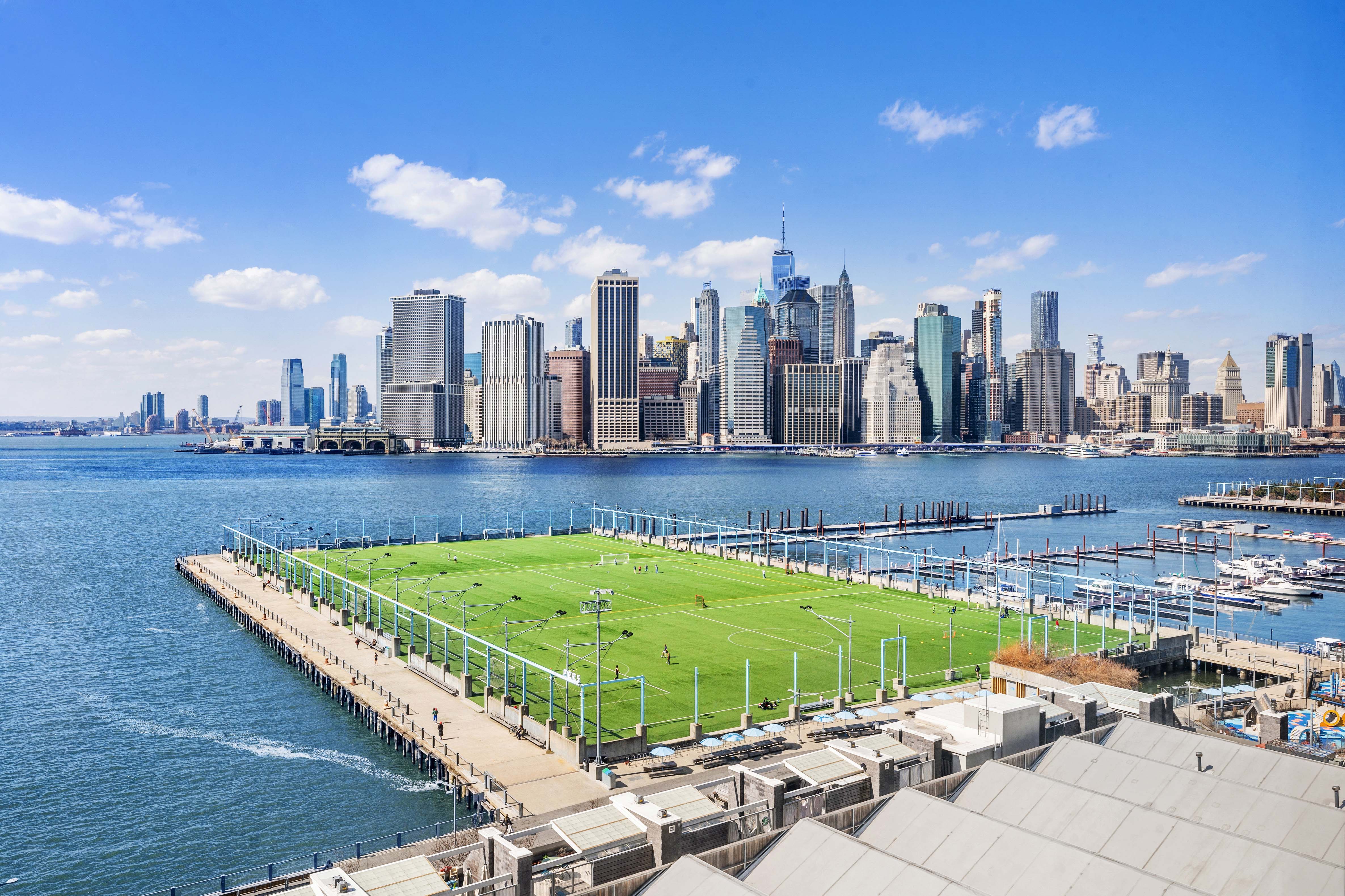 360 Furman Street, Unit 734 Brooklyn, NY 11201 - Photo 2 of 31 a view of a swimming pool with a patio