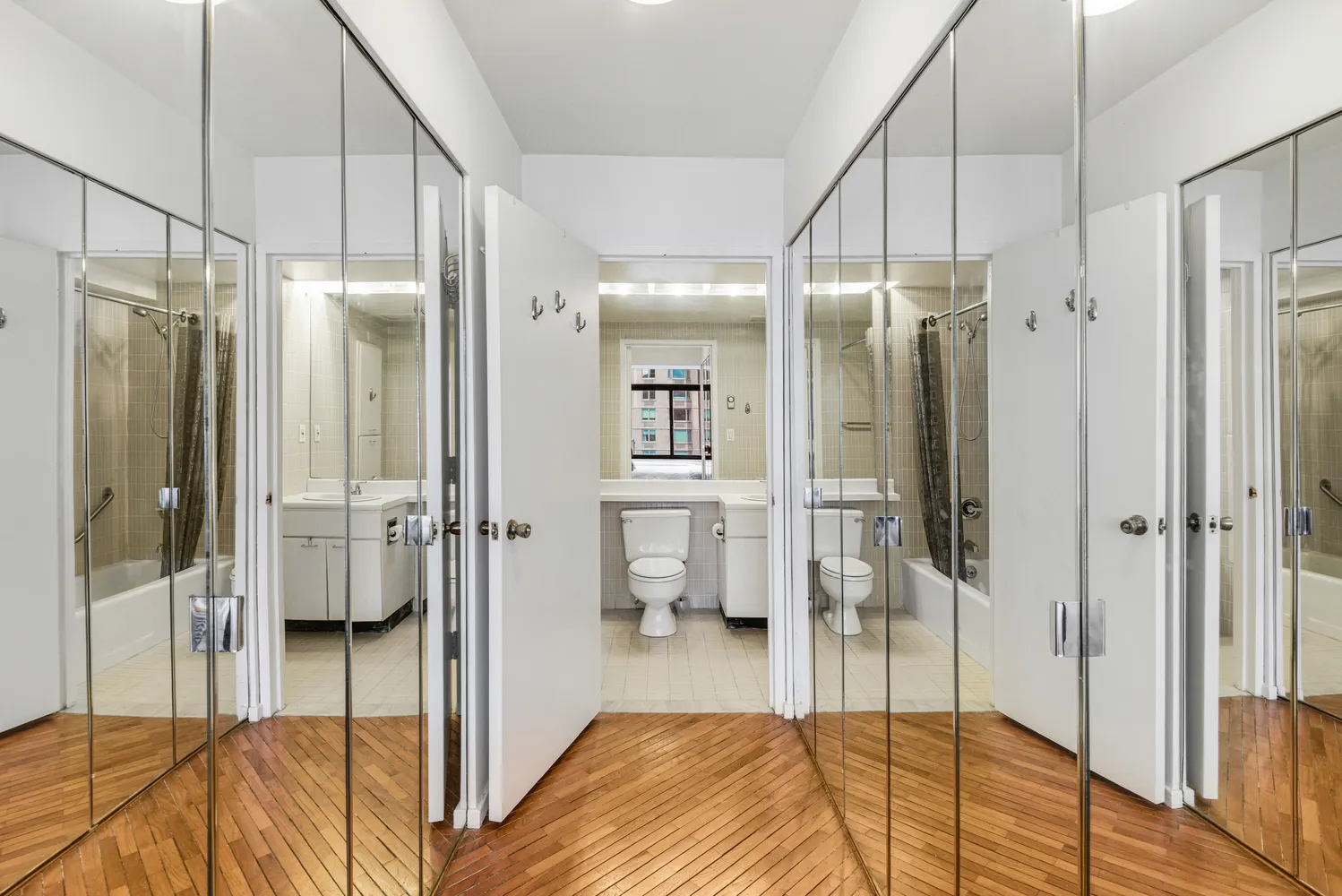 a spacious bedroom with a bed and a walk in closet