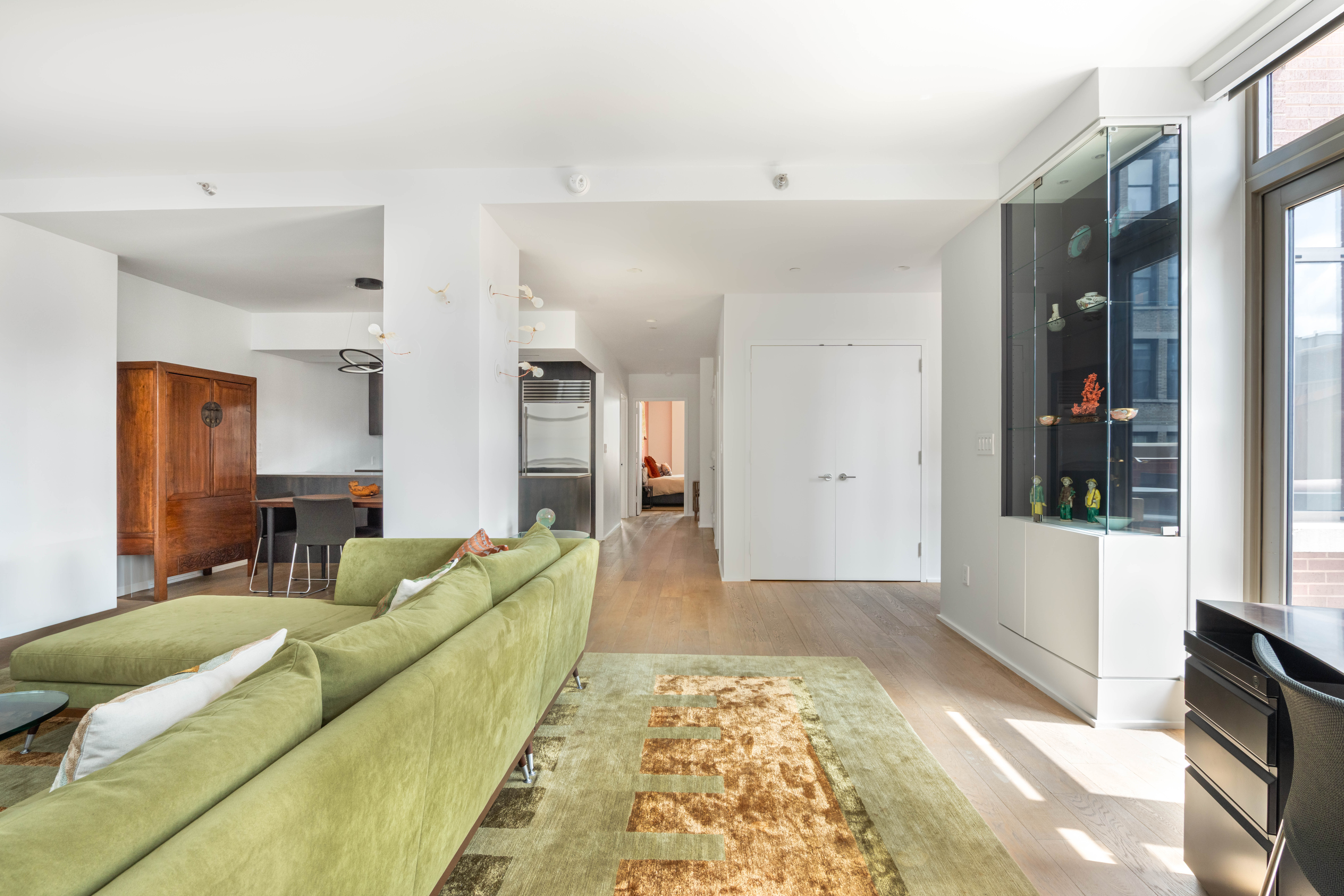 125 West 22nd Street, Unit 10A Manhattan, NY 10011 - Photo 6 of 12 a living room with furniture and a rug