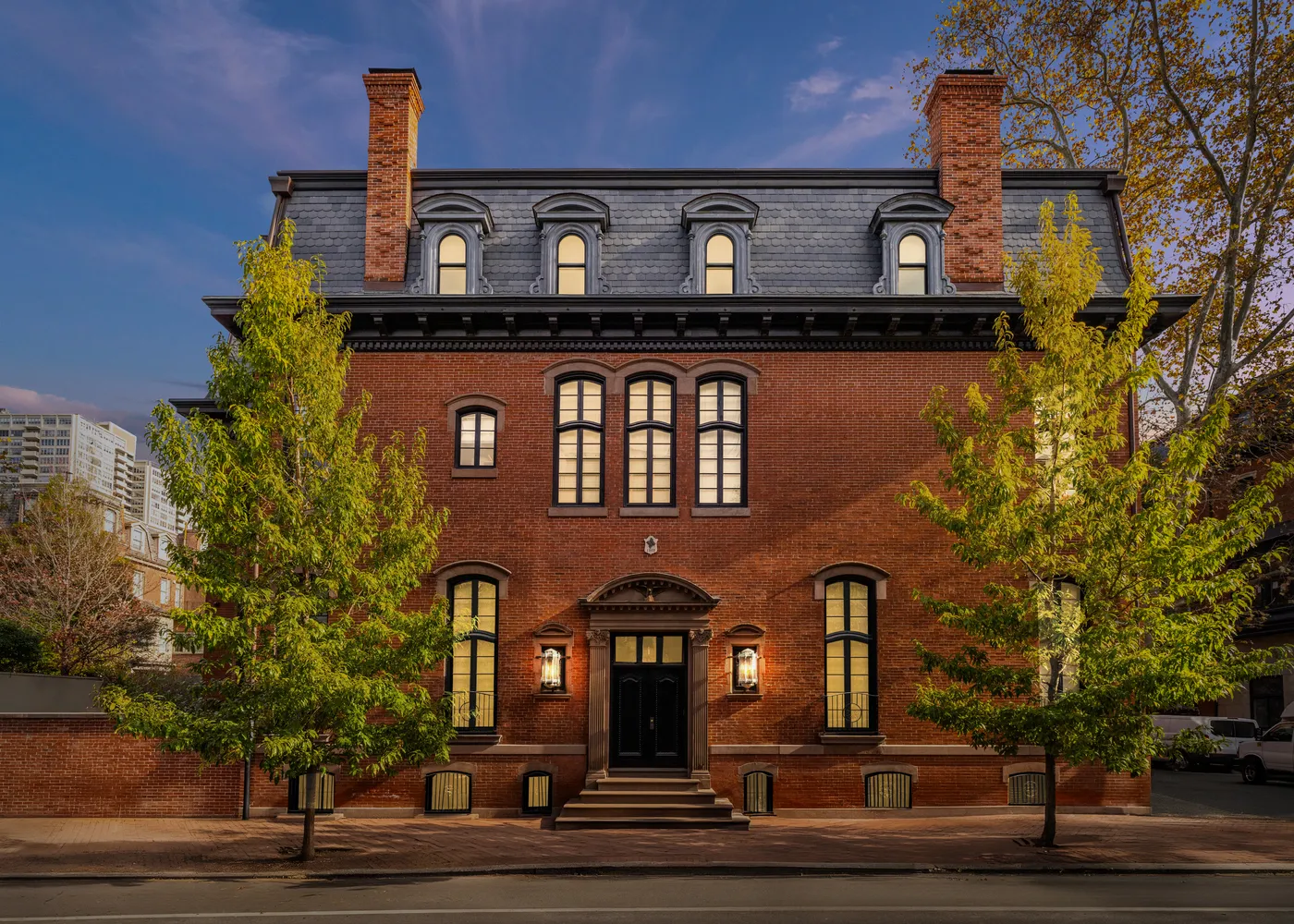a front view of a house with a garden