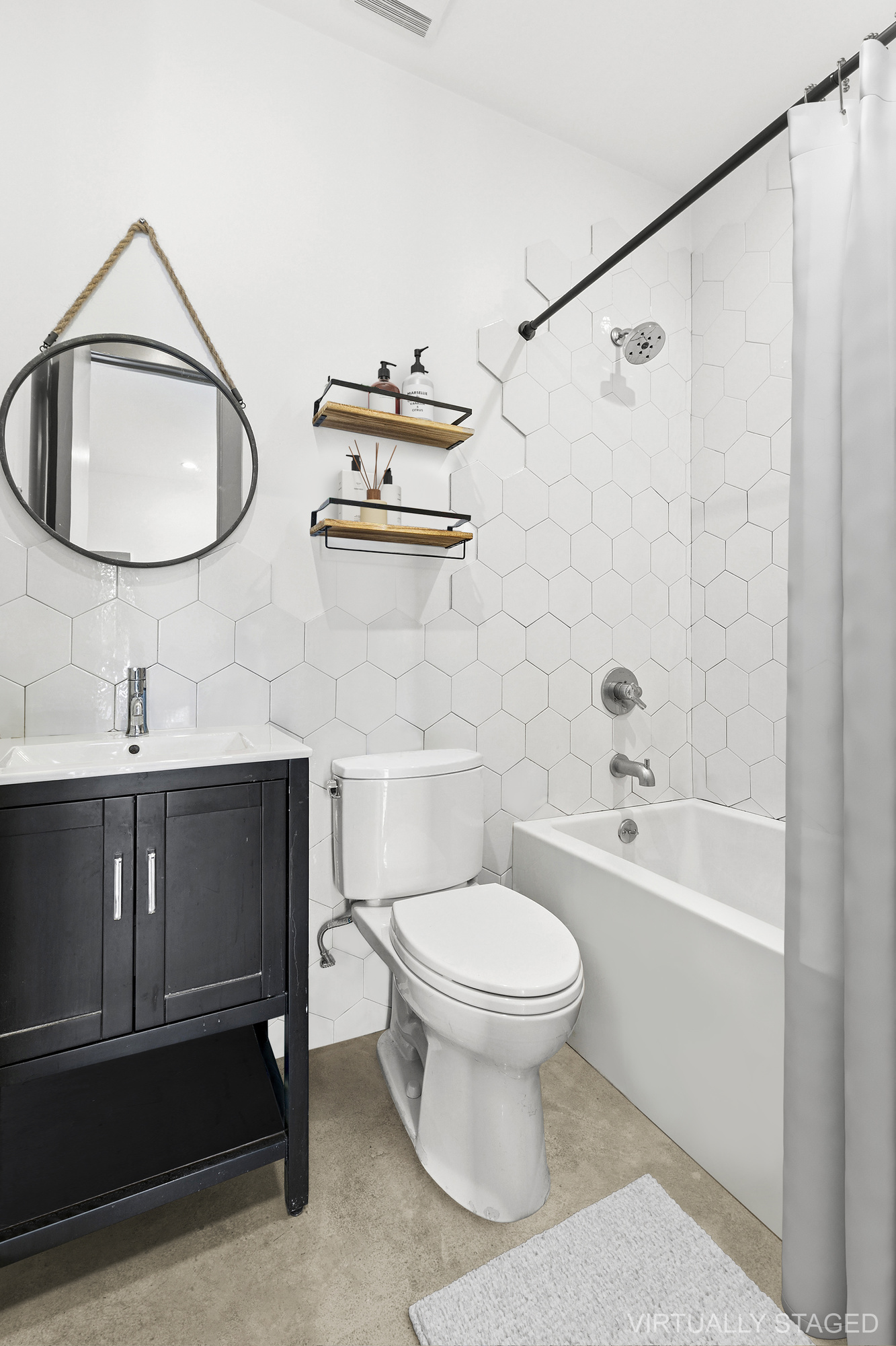 30 Belvidere Street, Unit 3A Brooklyn, NY 11206 - Photo 8 of 9 a bathroom with a sink toilet a mirror and shower