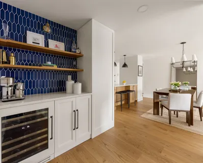 a kitchen with stainless steel appliances cabinets and a table