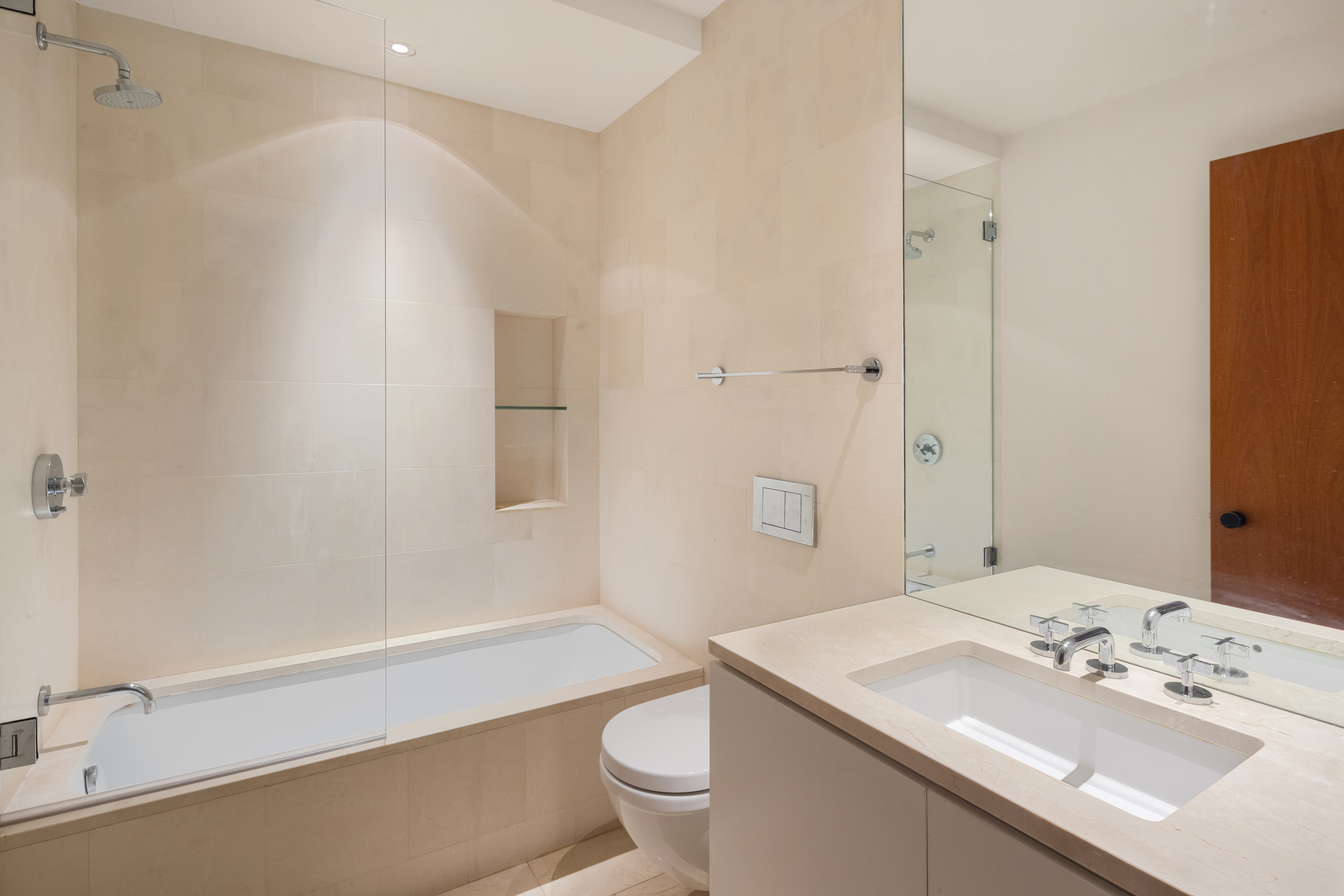 101 Wooster Street, Unit 3/4F Manhattan, NY 10012 - Photo 10 of 16 a bathroom with a sink a toilet and shower