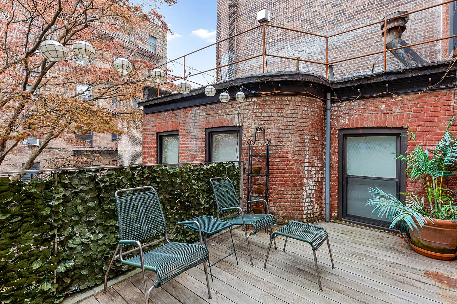 a brick building with a chair and table in it