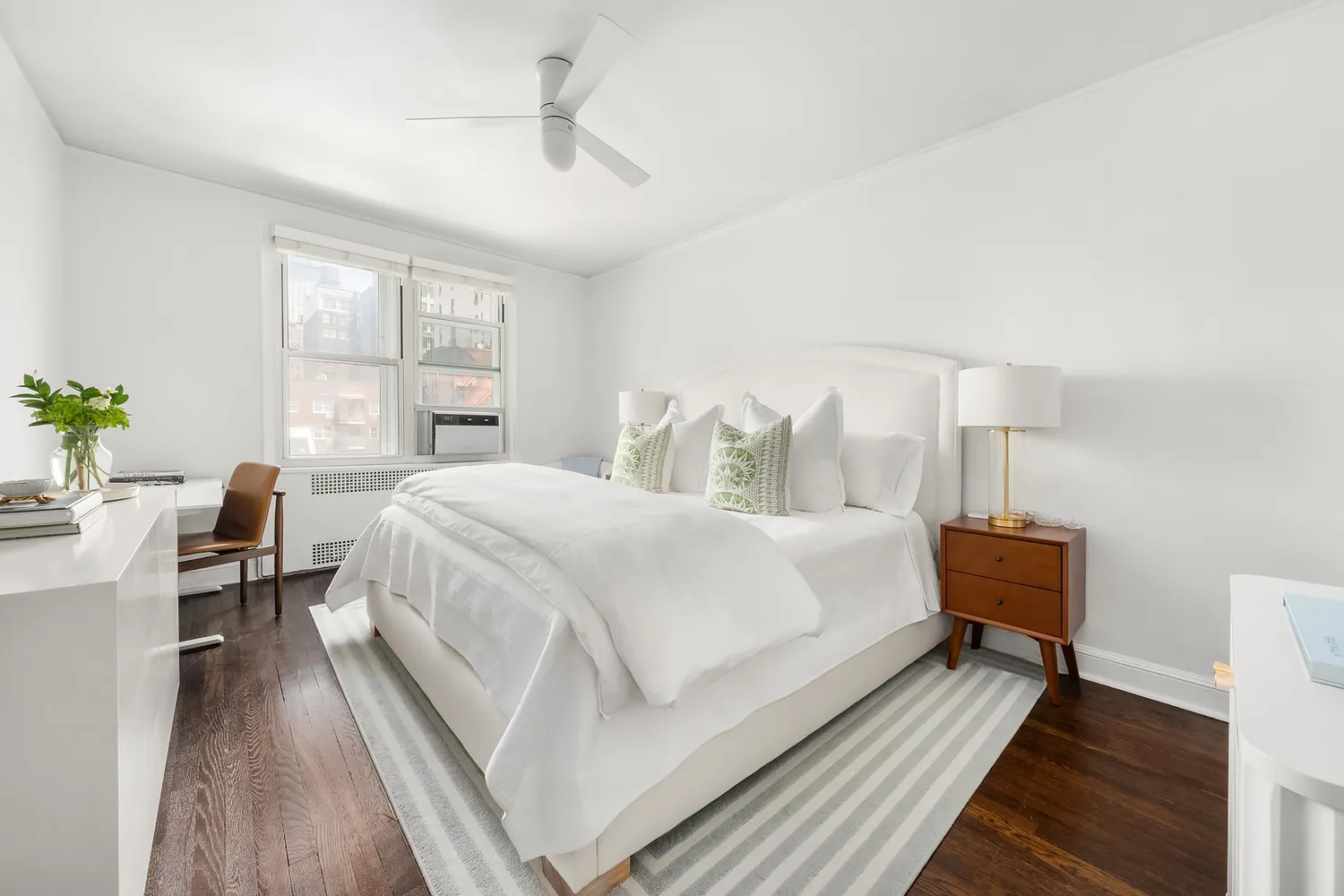 a bed room with a bed and a chair