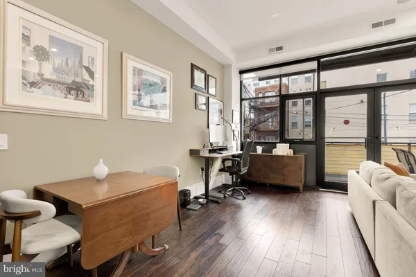 a bedroom with furniture and a window