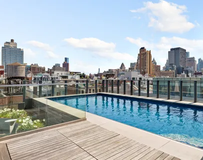a view of swimming pool from a balcony