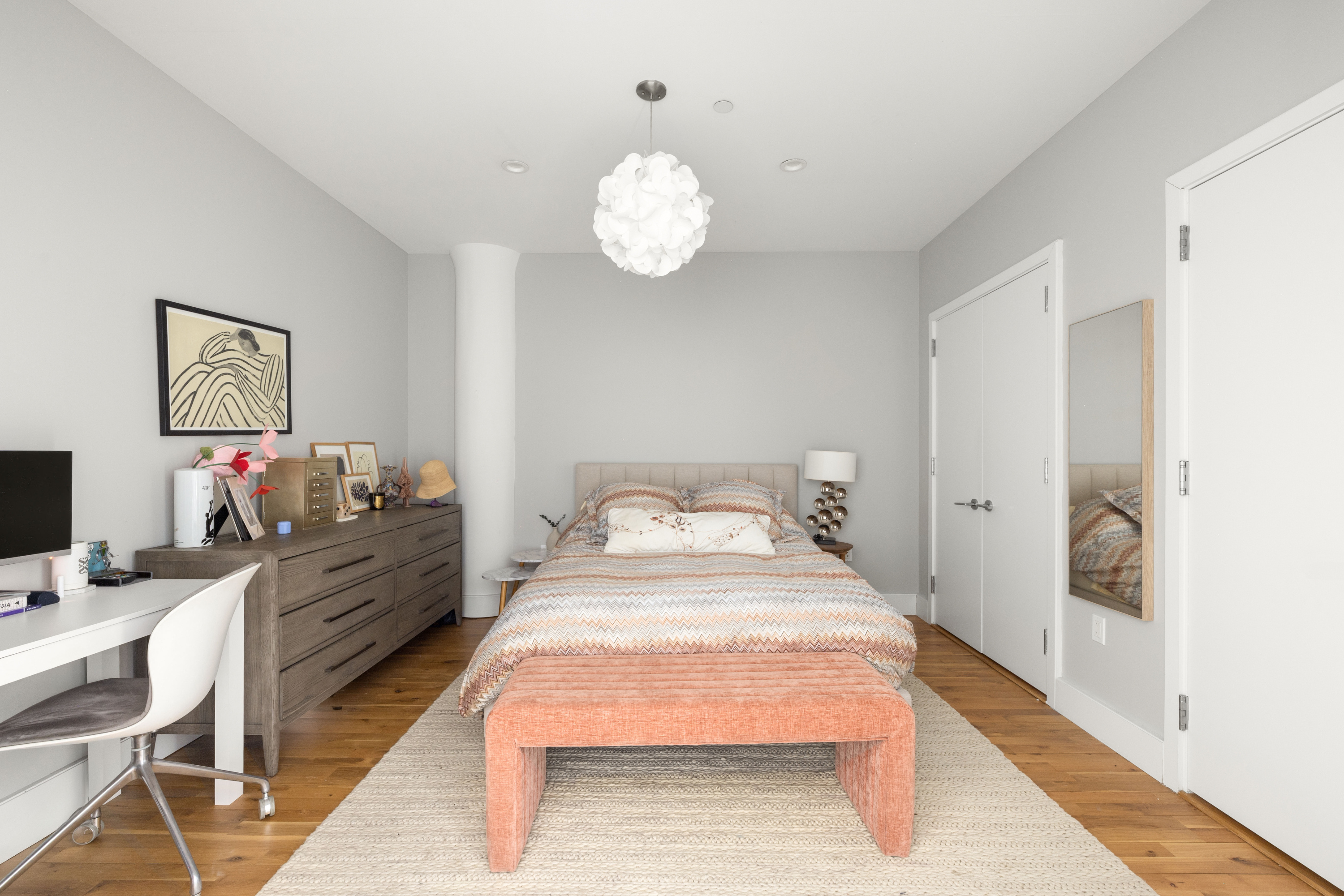 360 Furman Street, Unit 1110 Brooklyn, NY 11201 - Photo 7 of 23 a bed room with a bed mirror and a table