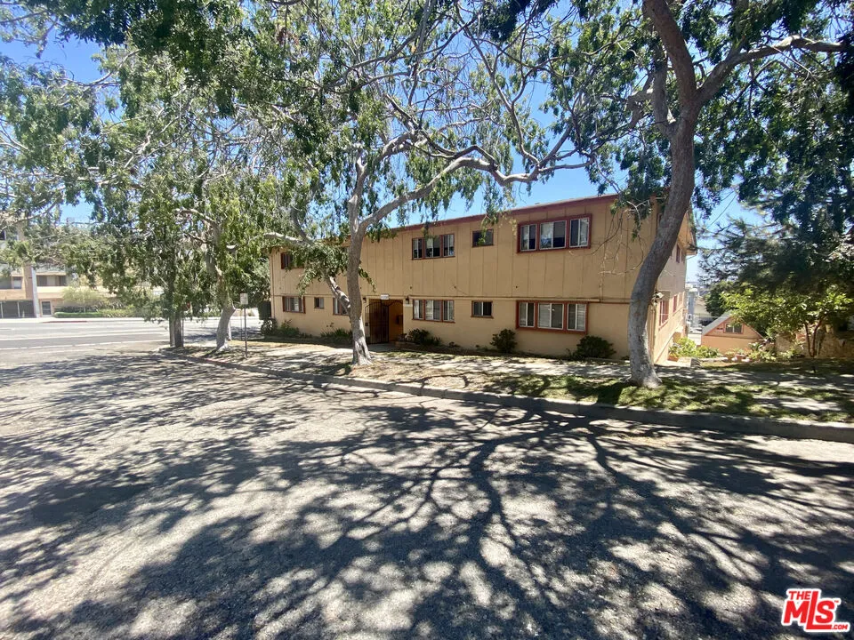 11150 Regent Street Los Angeles, CA 90034 - Photo 3 of 16 a view of a house with a yard