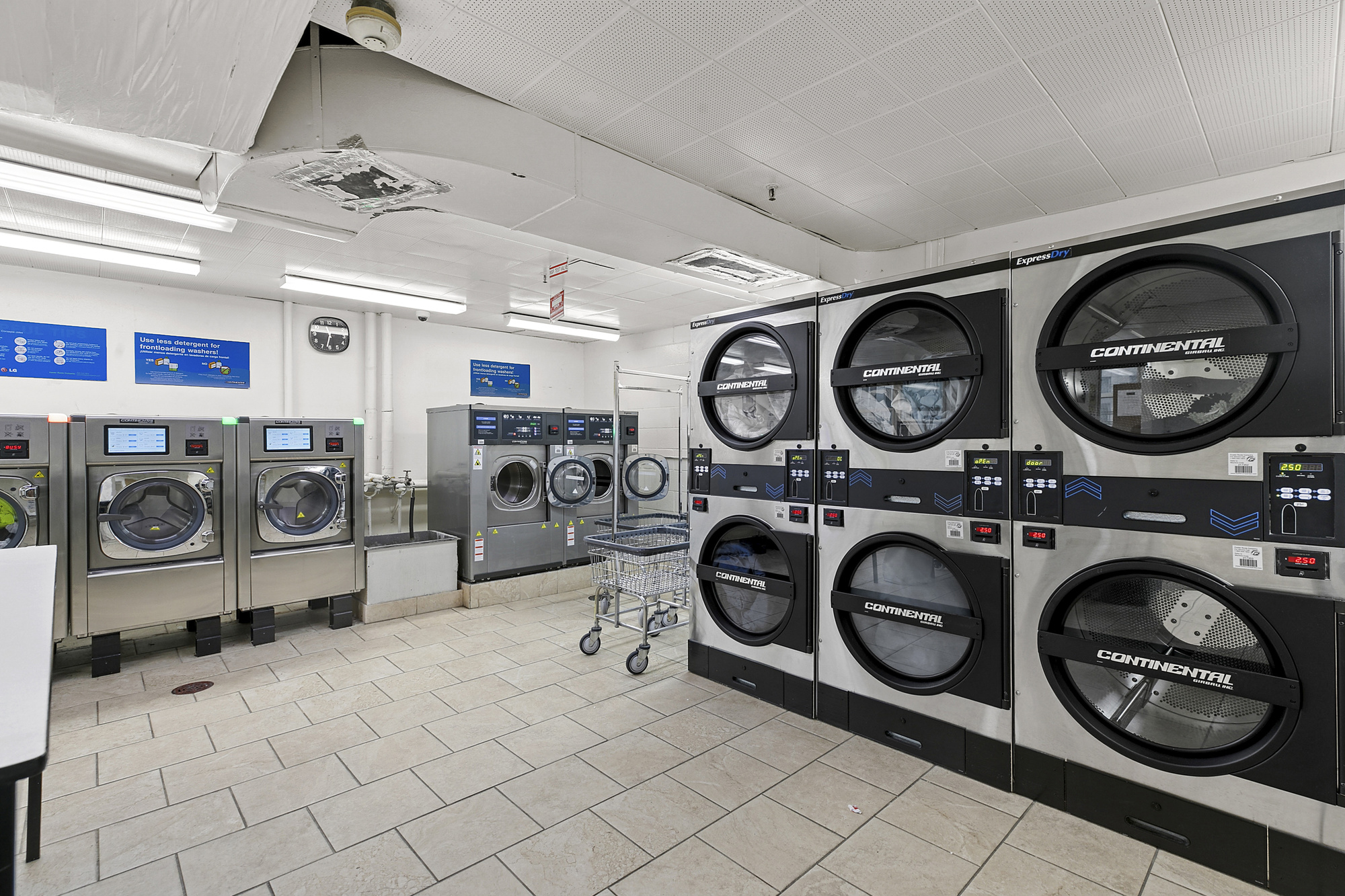 159 West 53rd Street, Unit 11D Manhattan, NY 10019 - Photo 7 of 9 a view of a storage & utility room with washer and dryer
