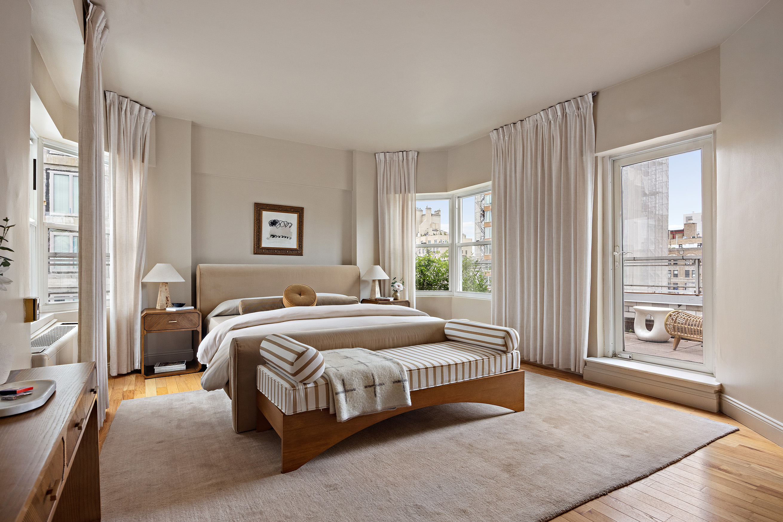 40 East 84th Street, Unit 17A Manhattan, NY 10028 - Photo 8 of 16 a bedroom with a bed lamp and a large window