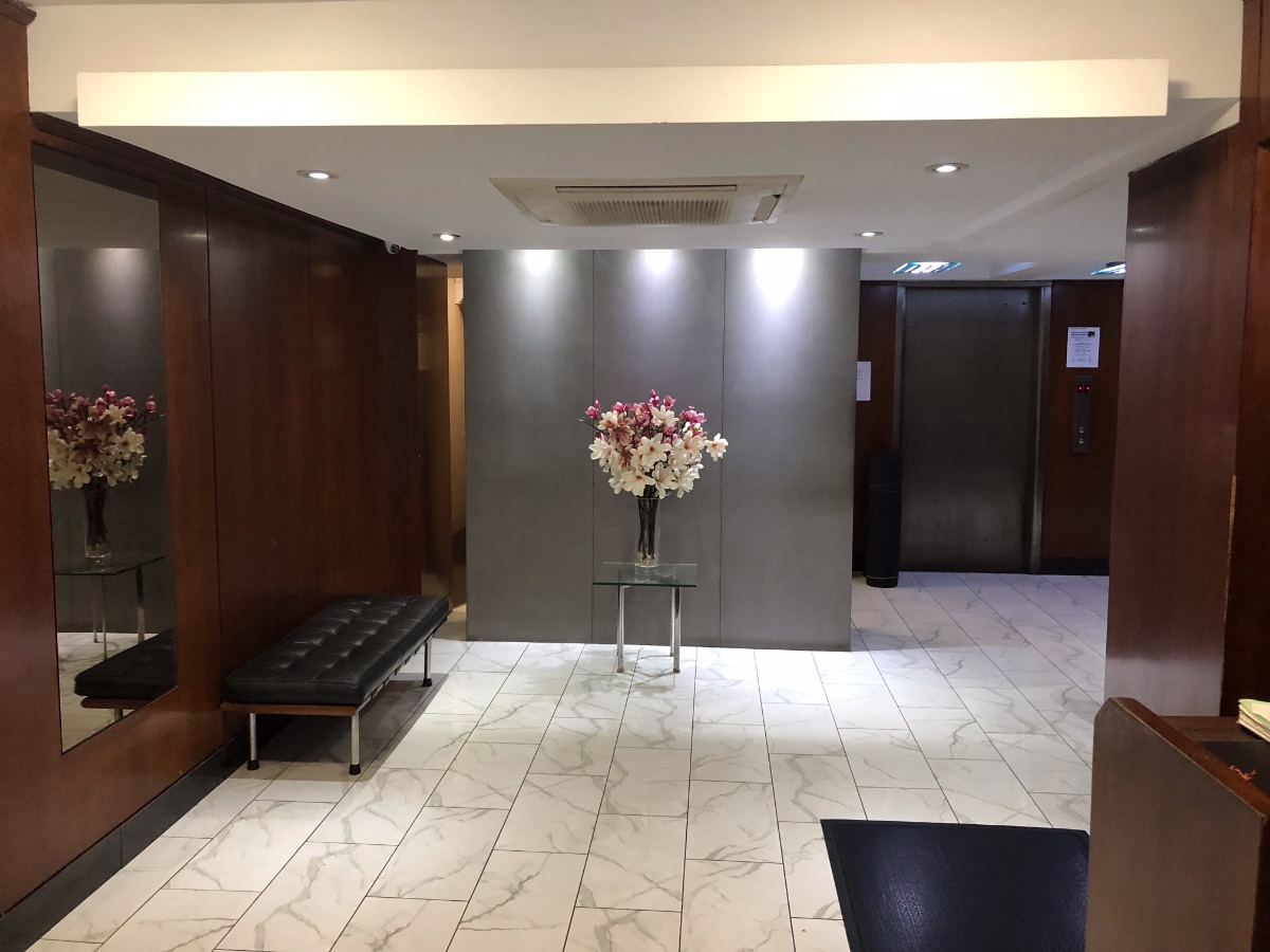 335 East 51st Street, Unit 10C Manhattan, NY 10022 - Photo 8 of 9 a lobby with a chandelier