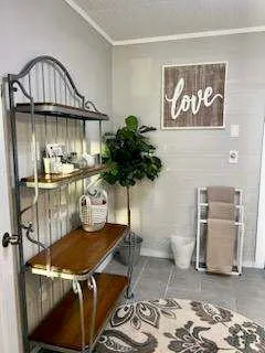 a view of a livingroom with furniture and a potted plant