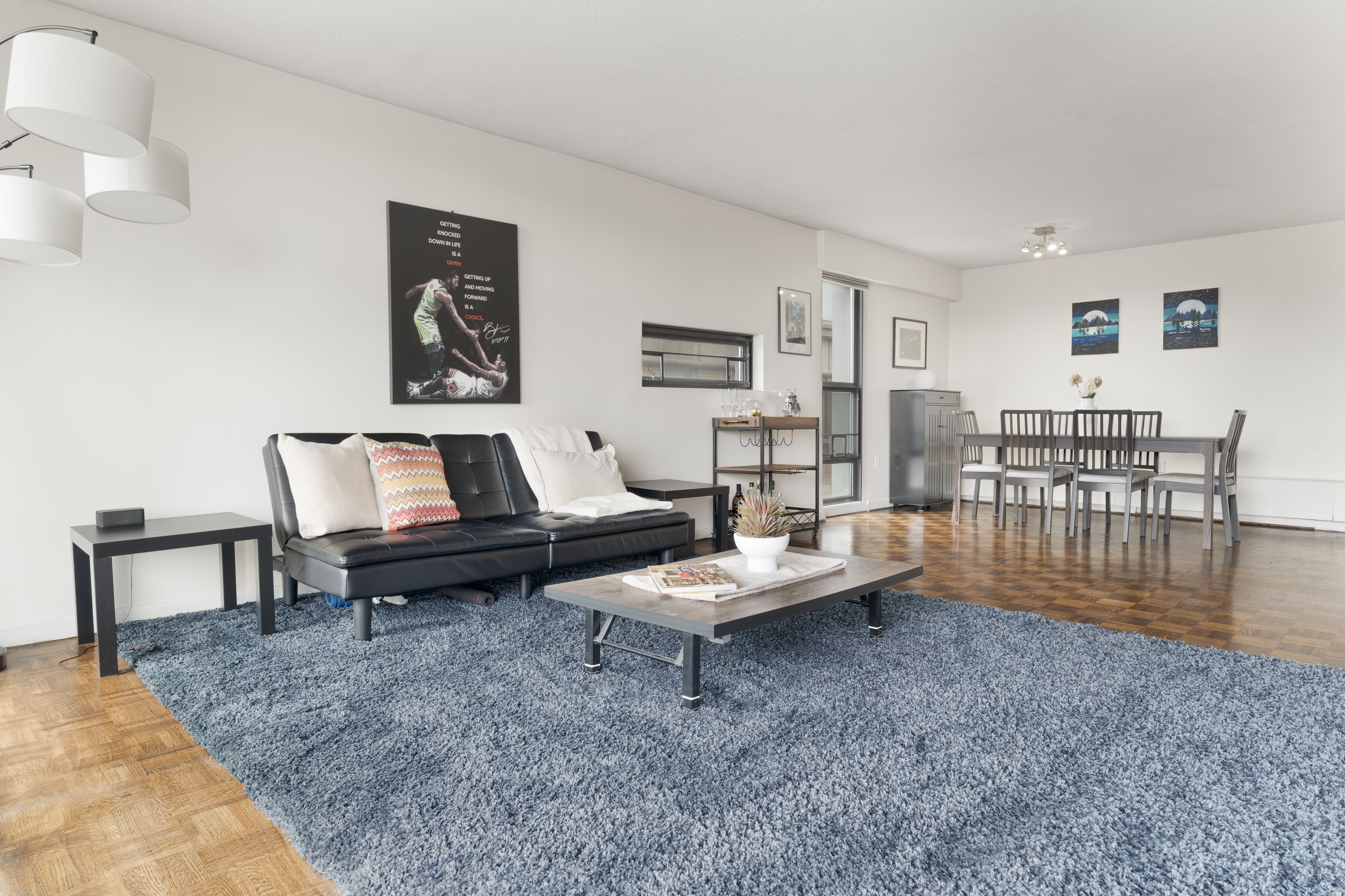 566 Commonwealth Avenue, Unit 1100 Boston, MA 02215 - Photo 4 of 13 a living room with furniture and wooden floor