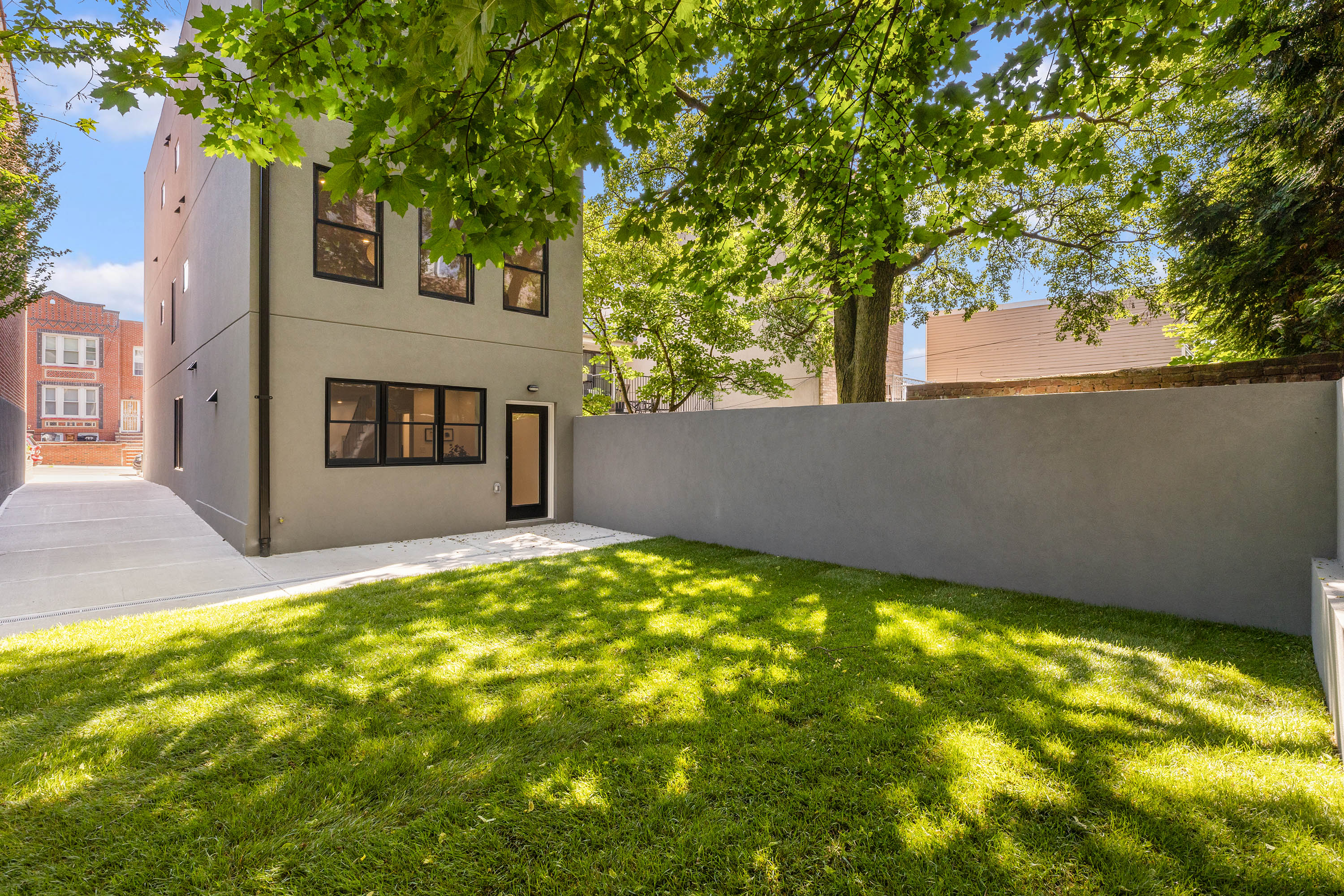 578 20th Street Brooklyn, NY 11218 - Photo 23 of 28 a view of a house with a backyard