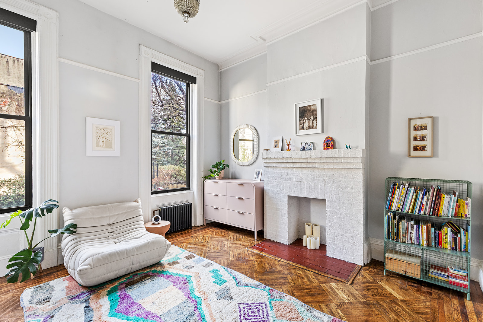 331 A Stuyvesant Avenue Brooklyn, NY 11233 - Photo 12 of 21 a living room with furniture and a fireplace