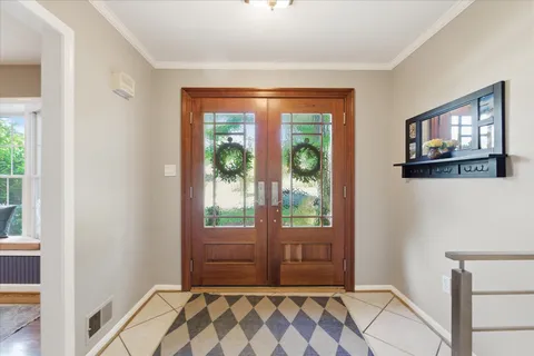 a bathroom with a glass door shower and a sink