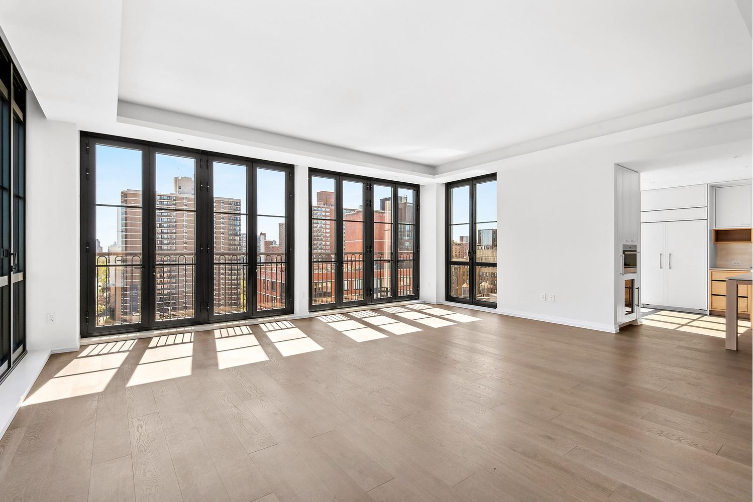 250 West 96th Street, Unit 18C Manhattan, NY 10025 - Photo 6 of 28 a view of an empty room with wooden floor and windows