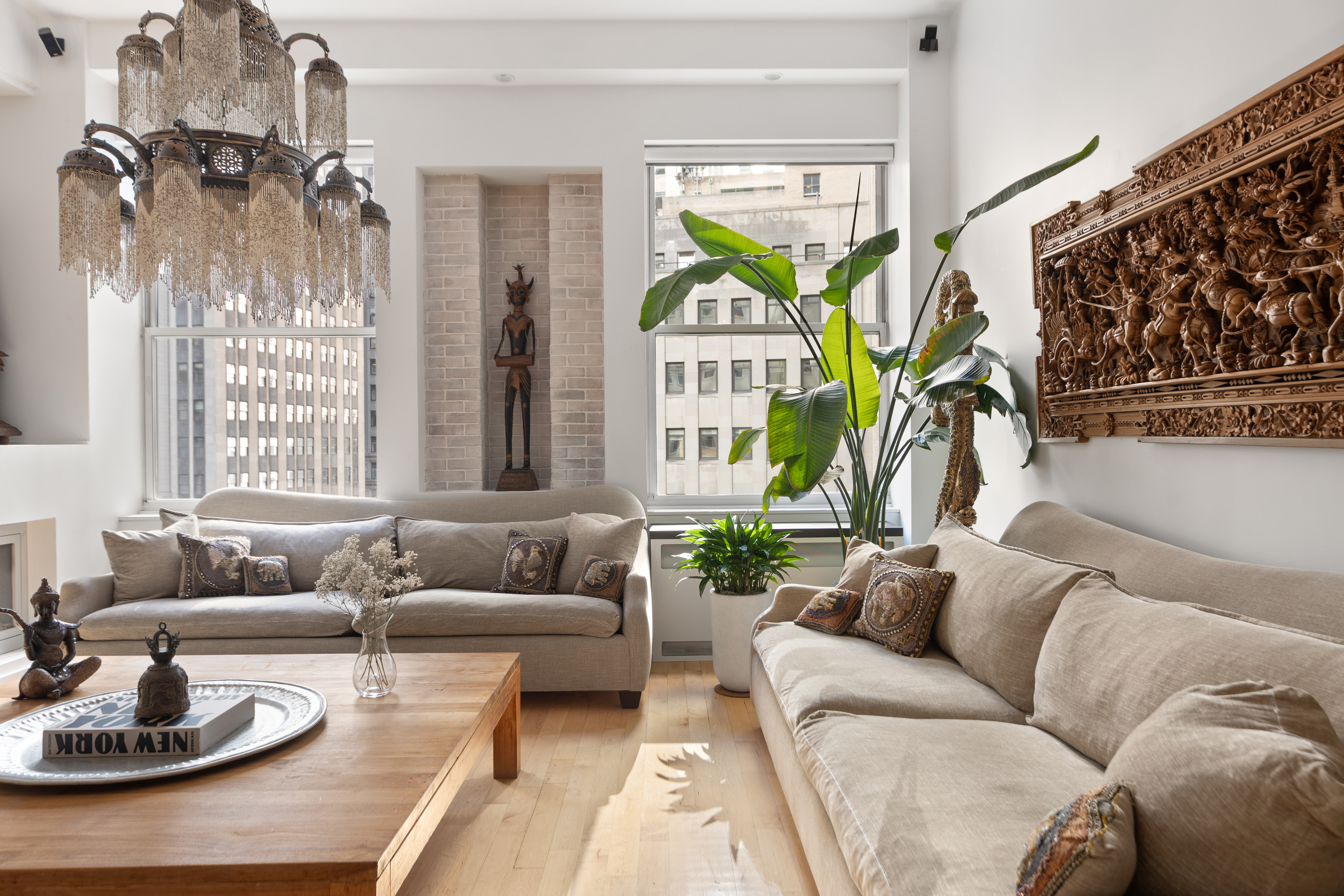 15 Broad Street, Unit 1006 Manhattan, NY 10005 - Photo 5 of 32 a living room with furniture and a large window
