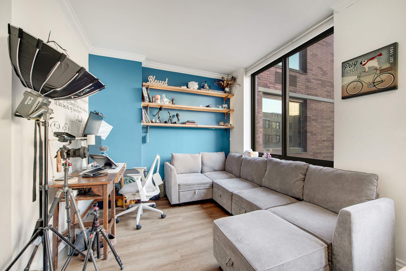400 East 90th Street, Unit 9A Manhattan, NY 10128 - Photo 2 of 11 a living room with furniture and a floor to ceiling window