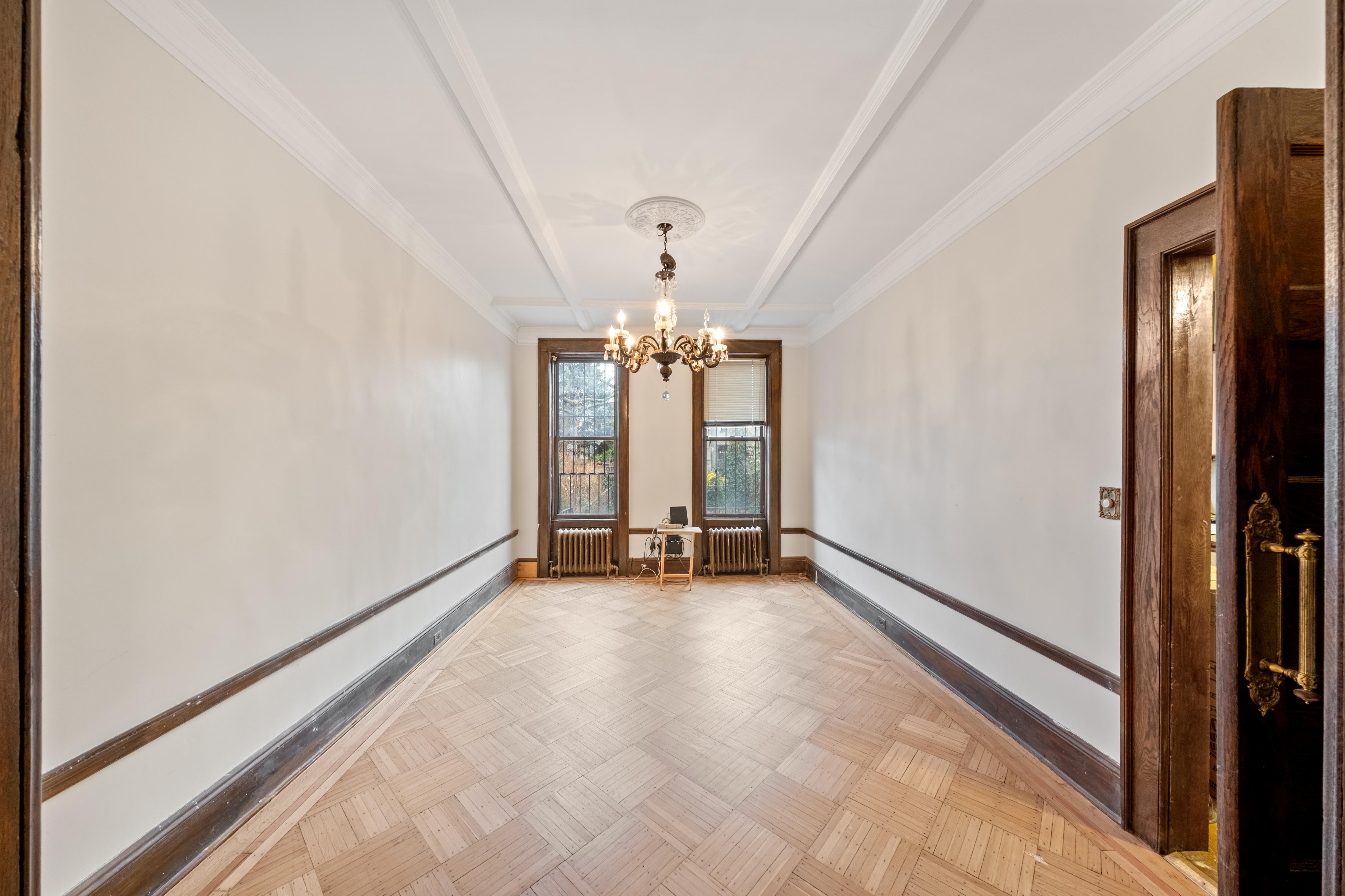 196 Maple Street Brooklyn, NY 11225 - Photo 6 of 31 a view of an empty room with a window