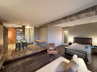 215 West 95th Street, Unit 11A Manhattan, NY 10025 - Photo 5 of 9 a living room with furniture and a table