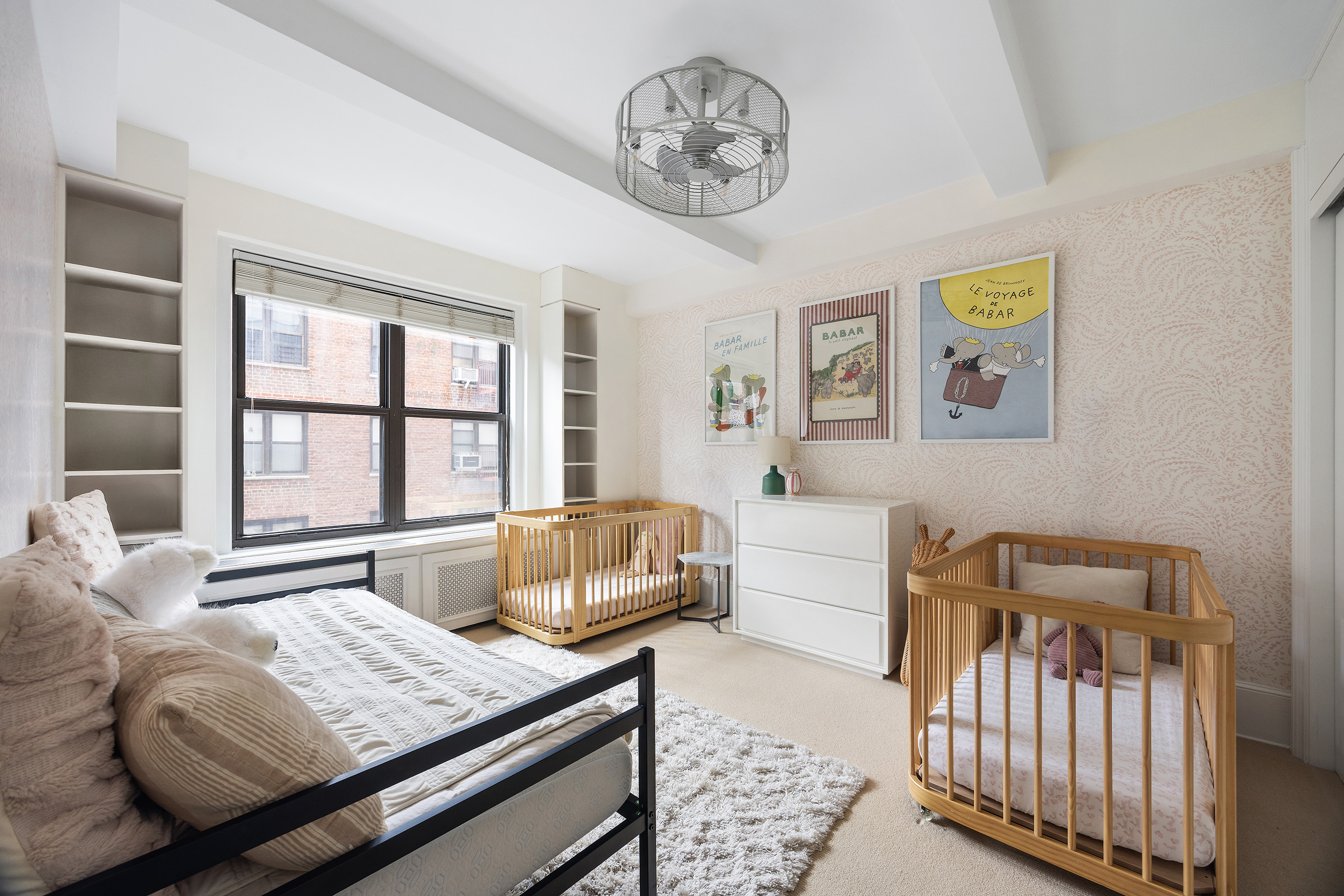 325 East 79th Street, Unit 6C Manhattan, NY 10075 - Photo 12 of 17 a bedroom with furniture and a window