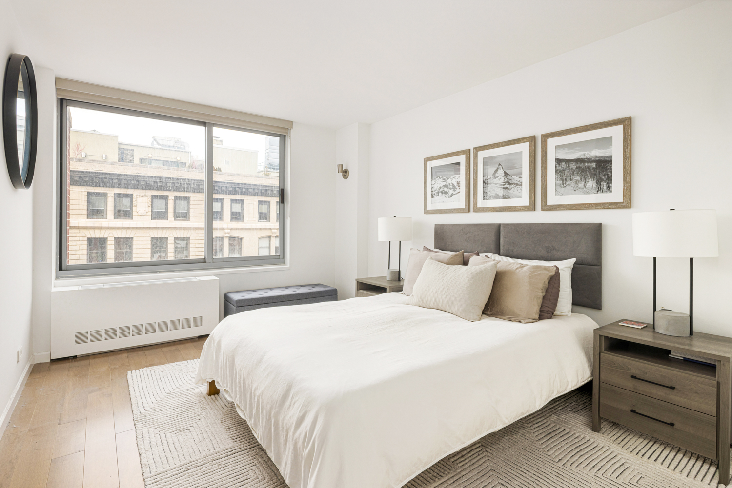270 West 17th Street, Unit 11BC Manhattan, NY 10011 - Photo 3 of 13 a bedroom with a large bed and a window