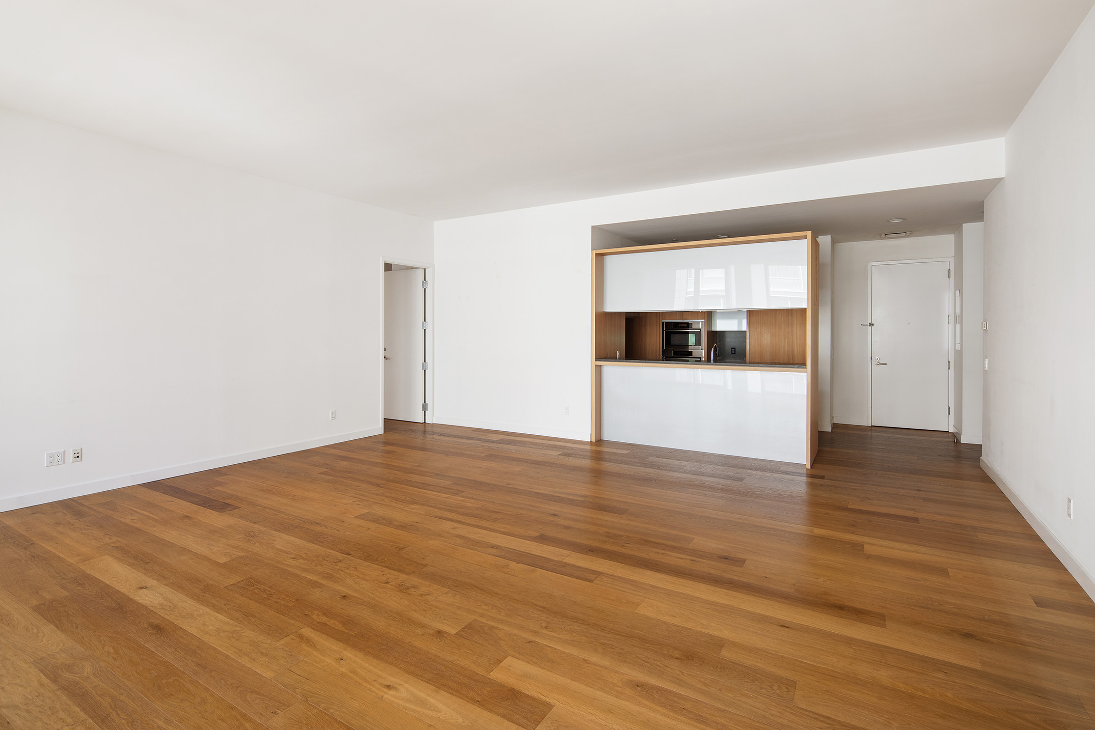 311 West Broadway, Unit 6J Manhattan, NY 10013 - Photo 4 of 19 a view of empty room with wooden floor