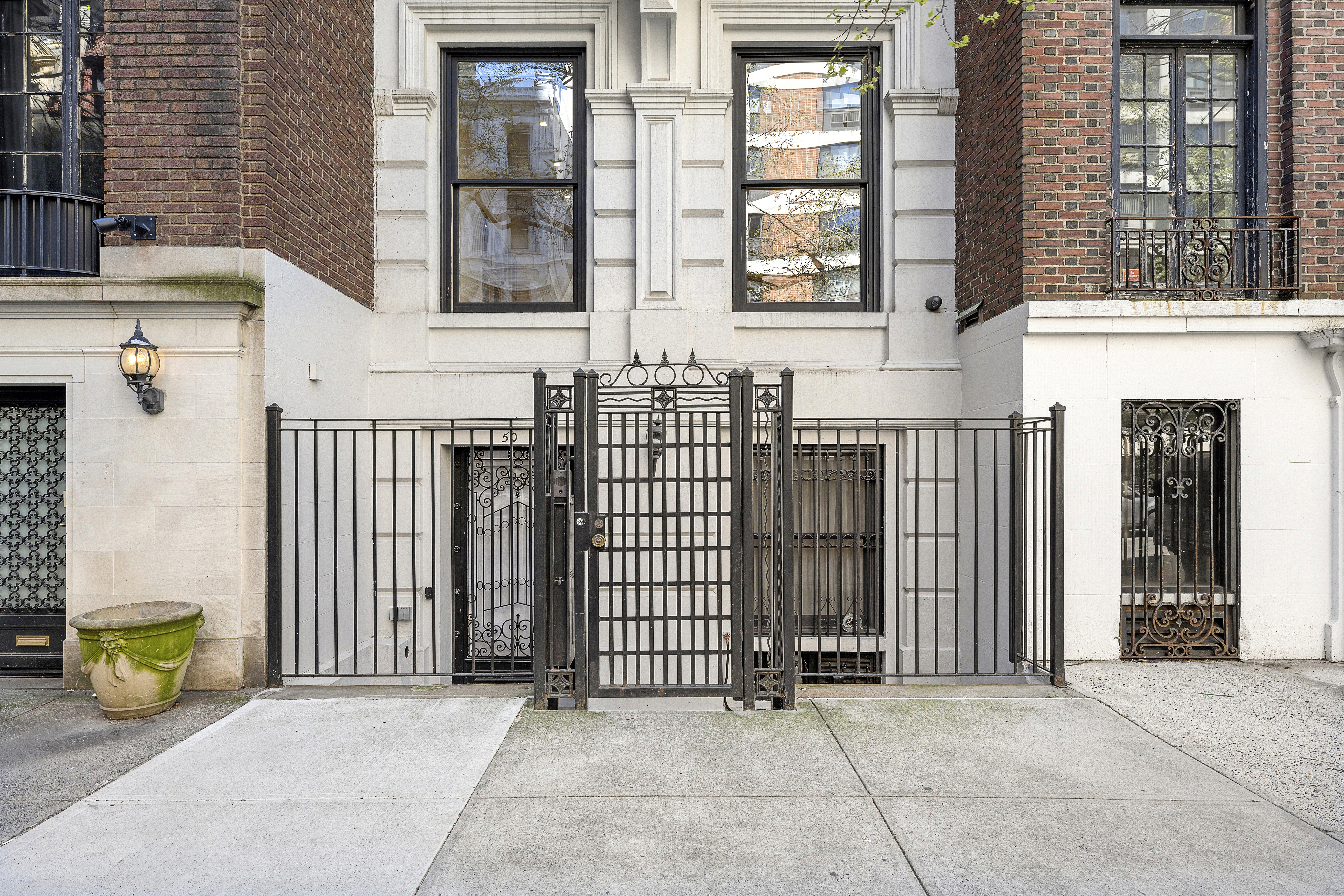 50 East 73rd Street Manhattan, NY 10021 - Photo 31 of 32 a view of a brick house with many windows