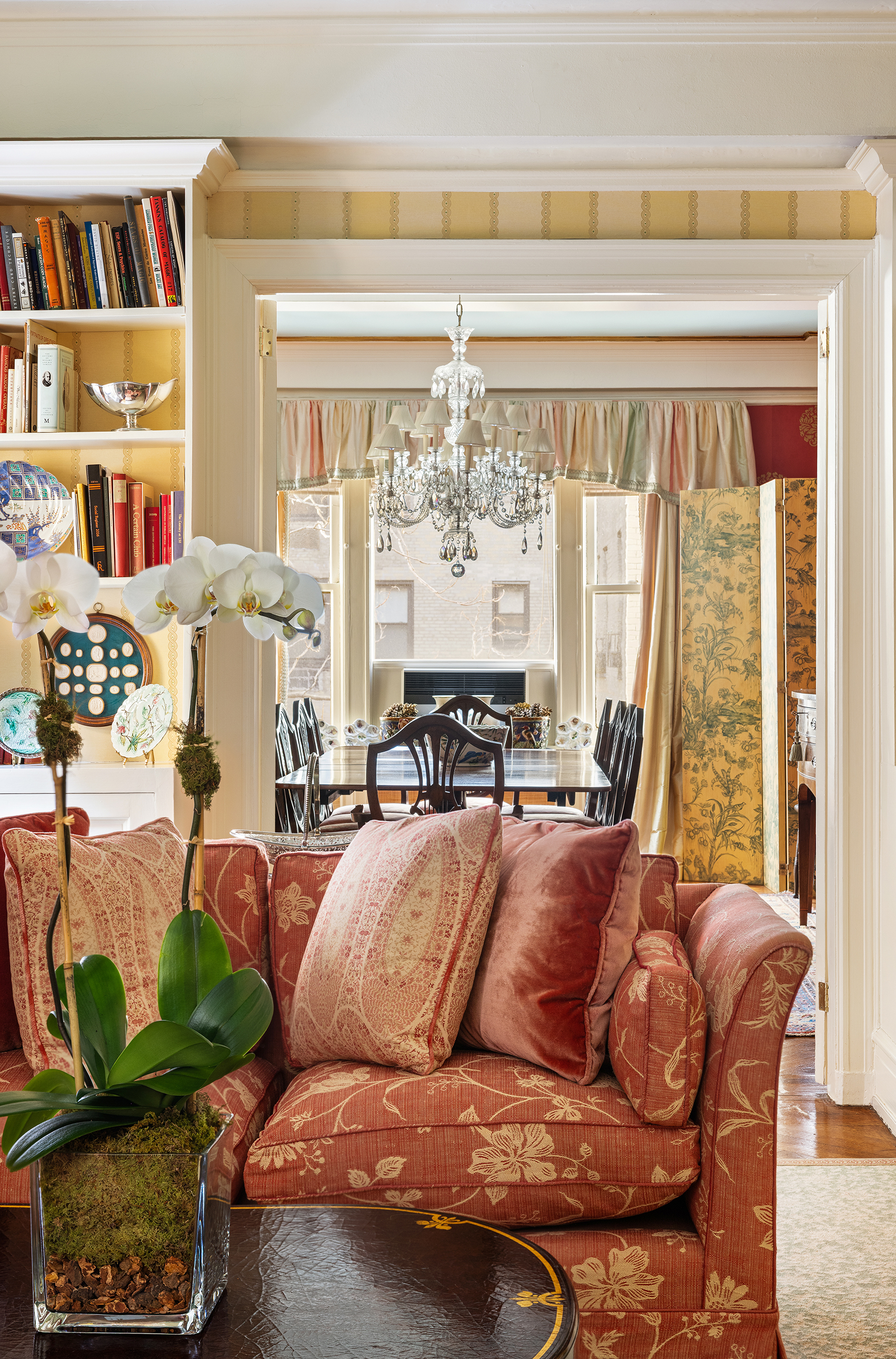 70 East 77th Street, Unit 6A Manhattan, NY 10075 - Photo 4 of 17 a living room with furniture and a large window