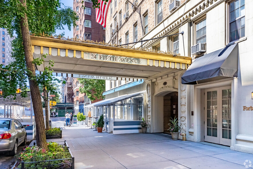 a front view of a building with outdoor seating