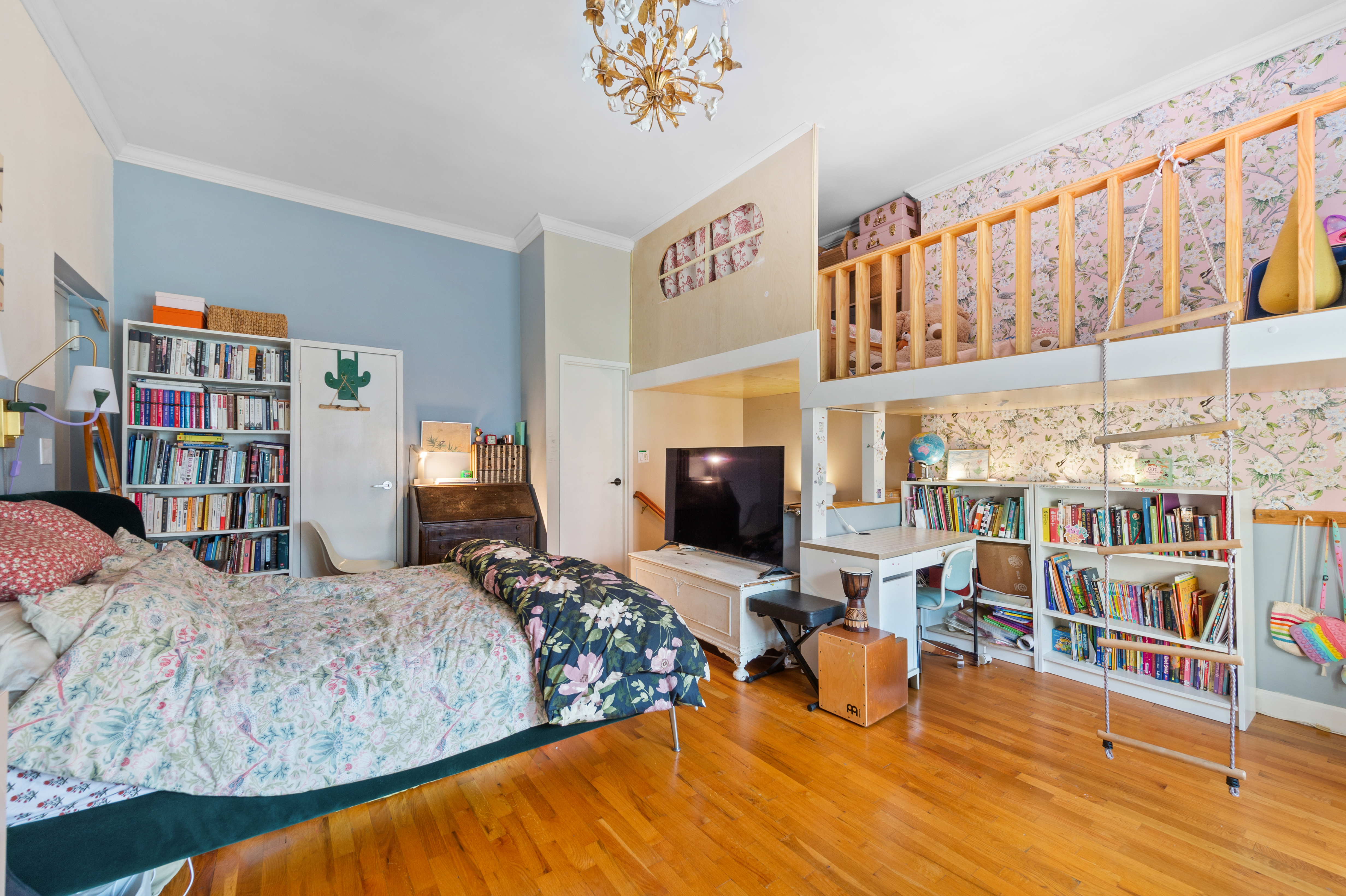 261 West 71st Street, Unit 8 Manhattan, NY 10023 - Photo 7 of 15 a bedroom with furniture and a book shelf
