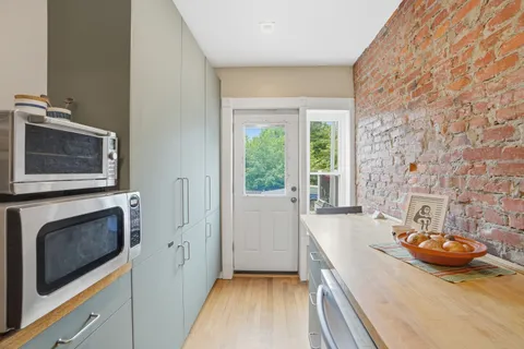 a view of a kitchen and dining room