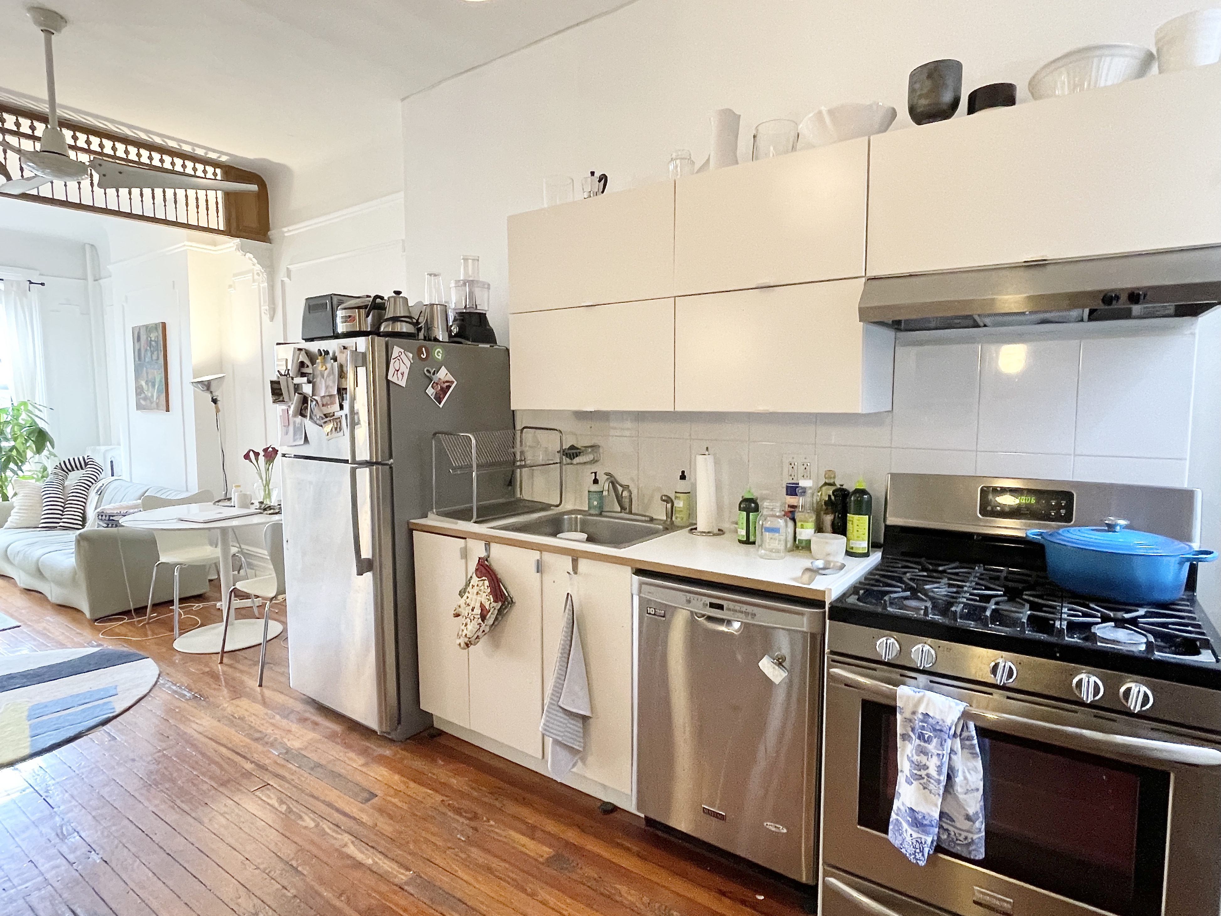 447 Jefferson Avenue, Unit 3L Brooklyn, NY 11221 - Photo 4 of 13 a kitchen with stainless steel appliances granite countertop a refrigerator a stove and a wooden floors