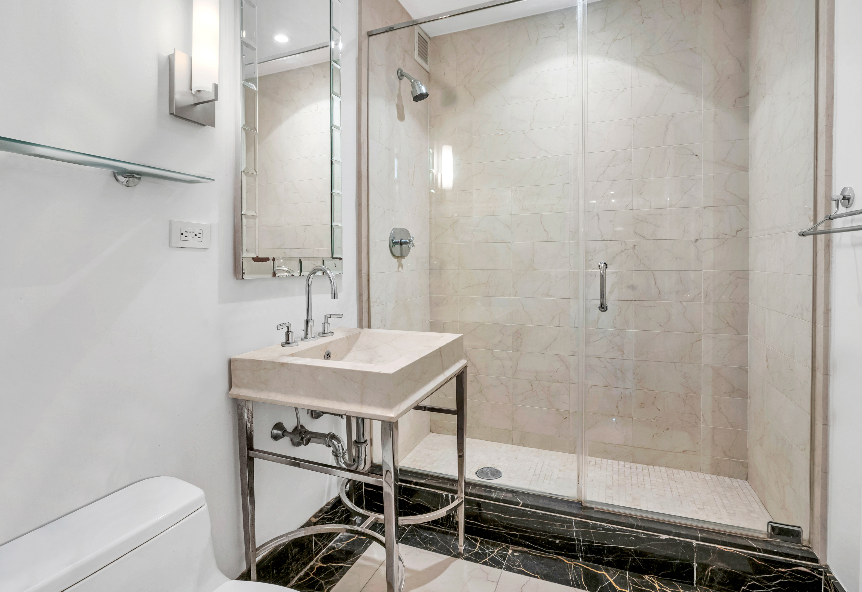 25 Columbus Circle, Unit 59F Manhattan, NY 10019 - Photo 6 of 15 a bathroom with a shower and a sink