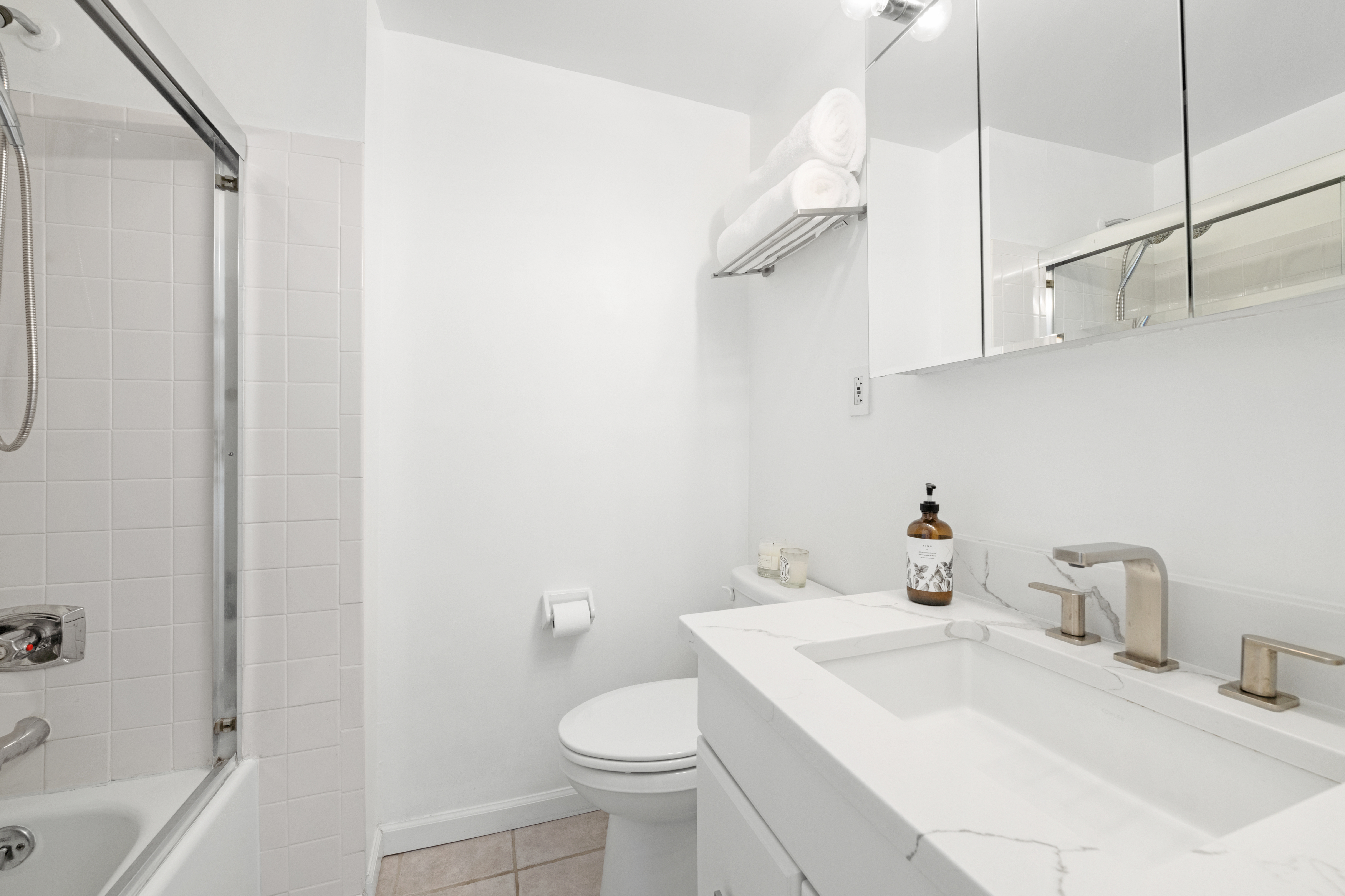 111 Hicks Street, Unit 6E Brooklyn, NY 11201 - Photo 8 of 11 a bathroom with a sink toilet and vanity