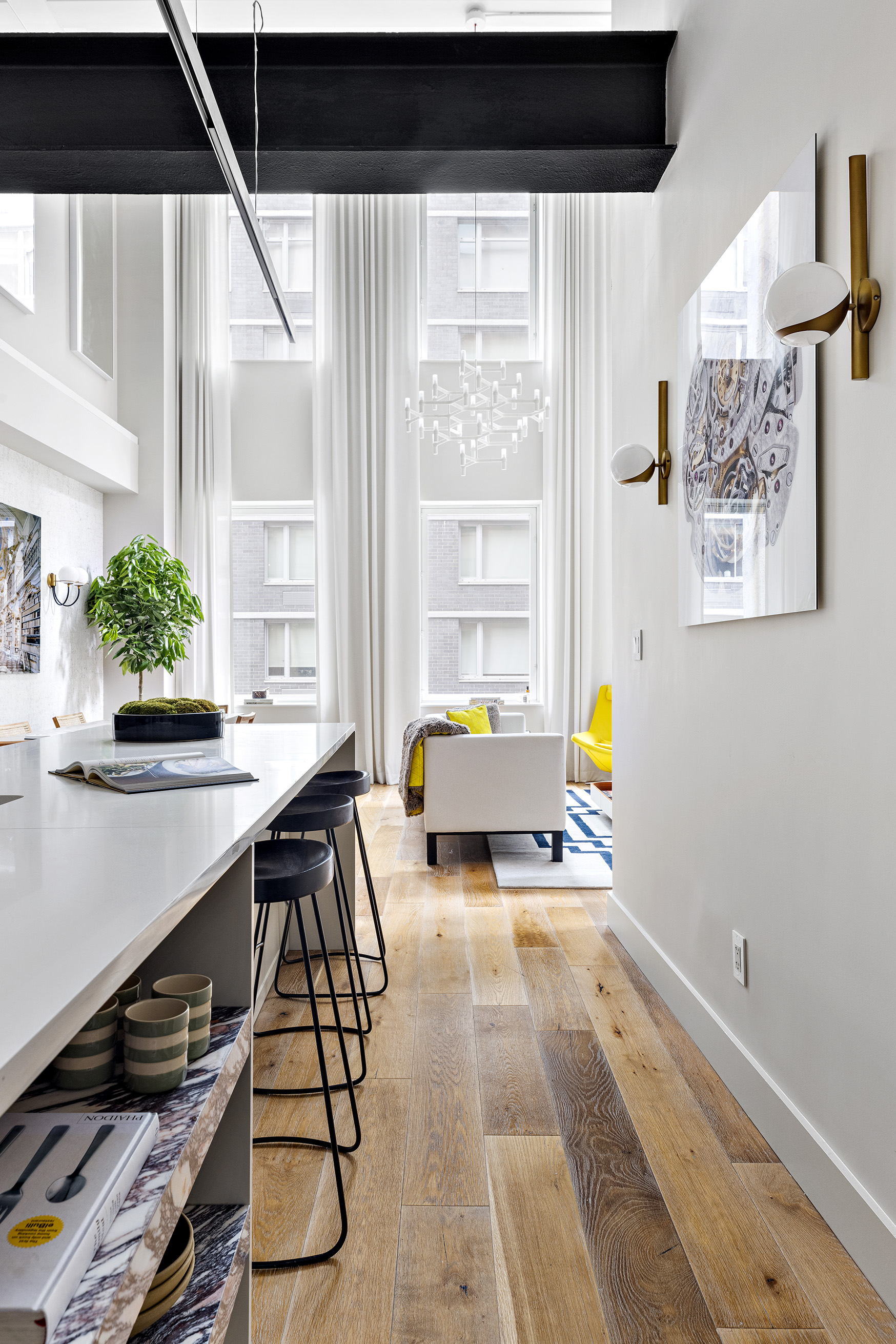 93 Worth Street, Unit 311 Manhattan, NY 10013 - Photo 7 of 17 a living room with furniture and a large window