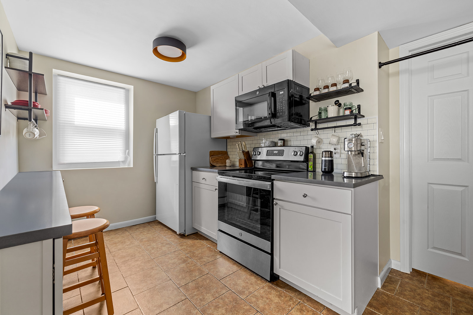 524 Beach 127th Street Queens, NY 11694 - Photo 13 of 18 a kitchen with stainless steel appliances granite countertop a refrigerator and a stove top oven