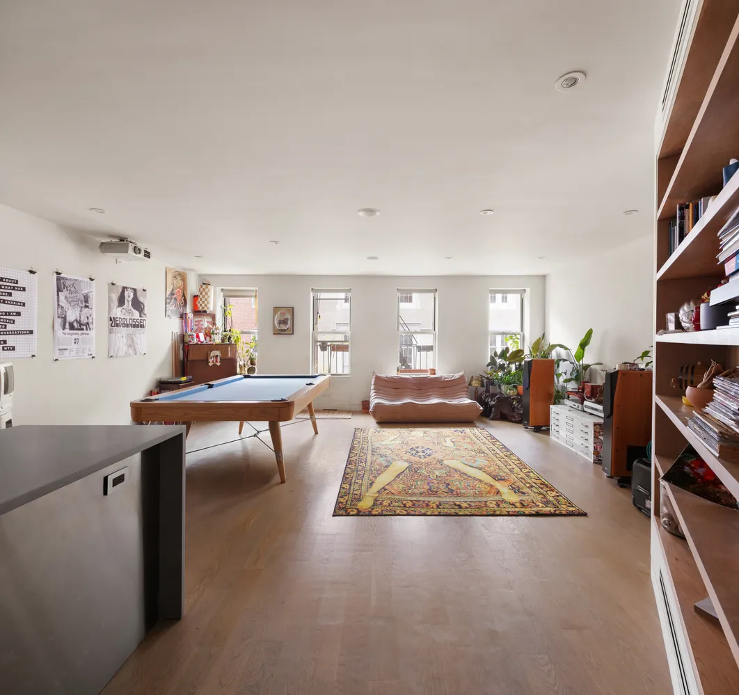 a living room with furniture and a table