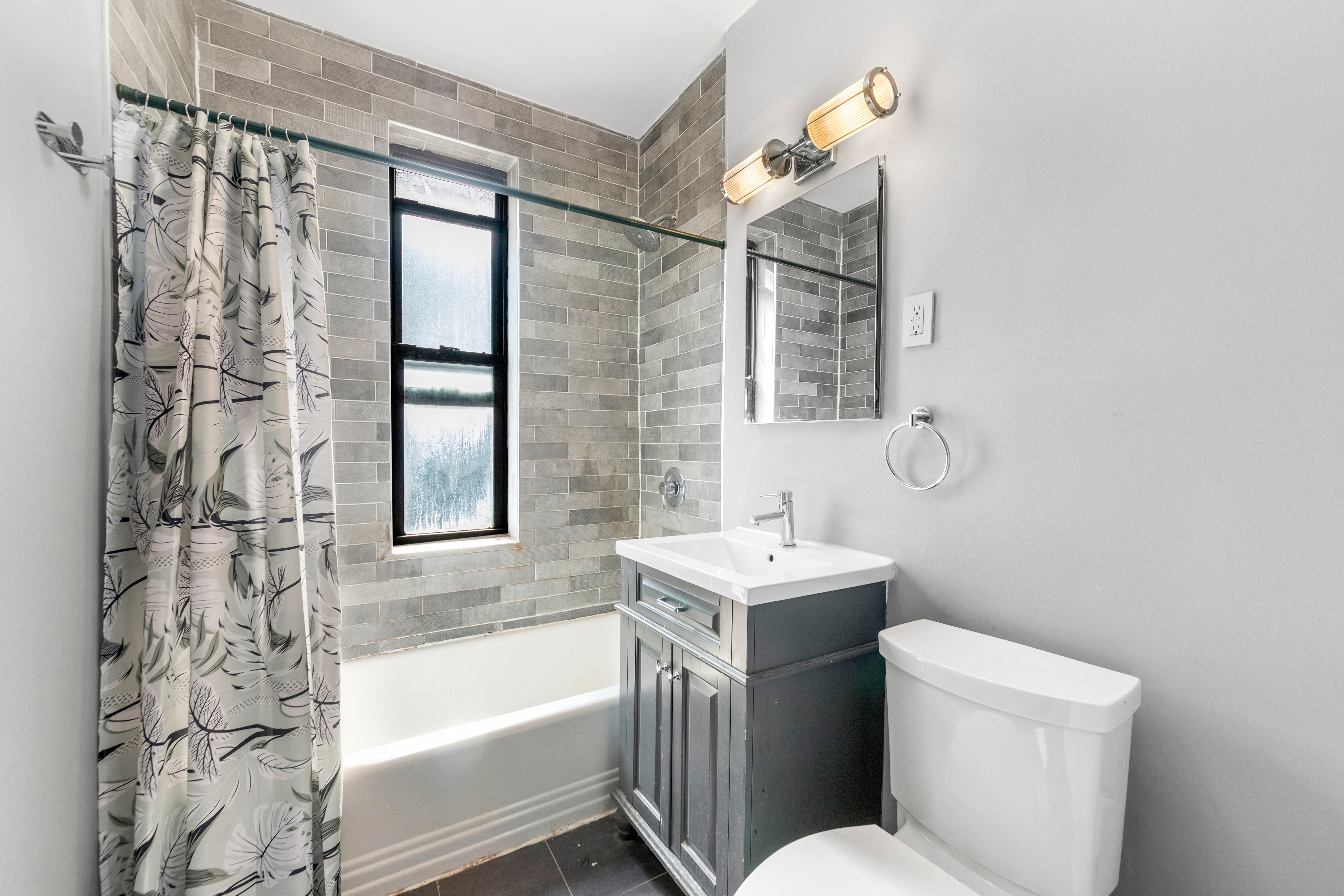 3220 Avenue H, Unit 6N Brooklyn, NY 11210 - Photo 6 of 9 a bathroom with a sink mirror toilet and bathtub