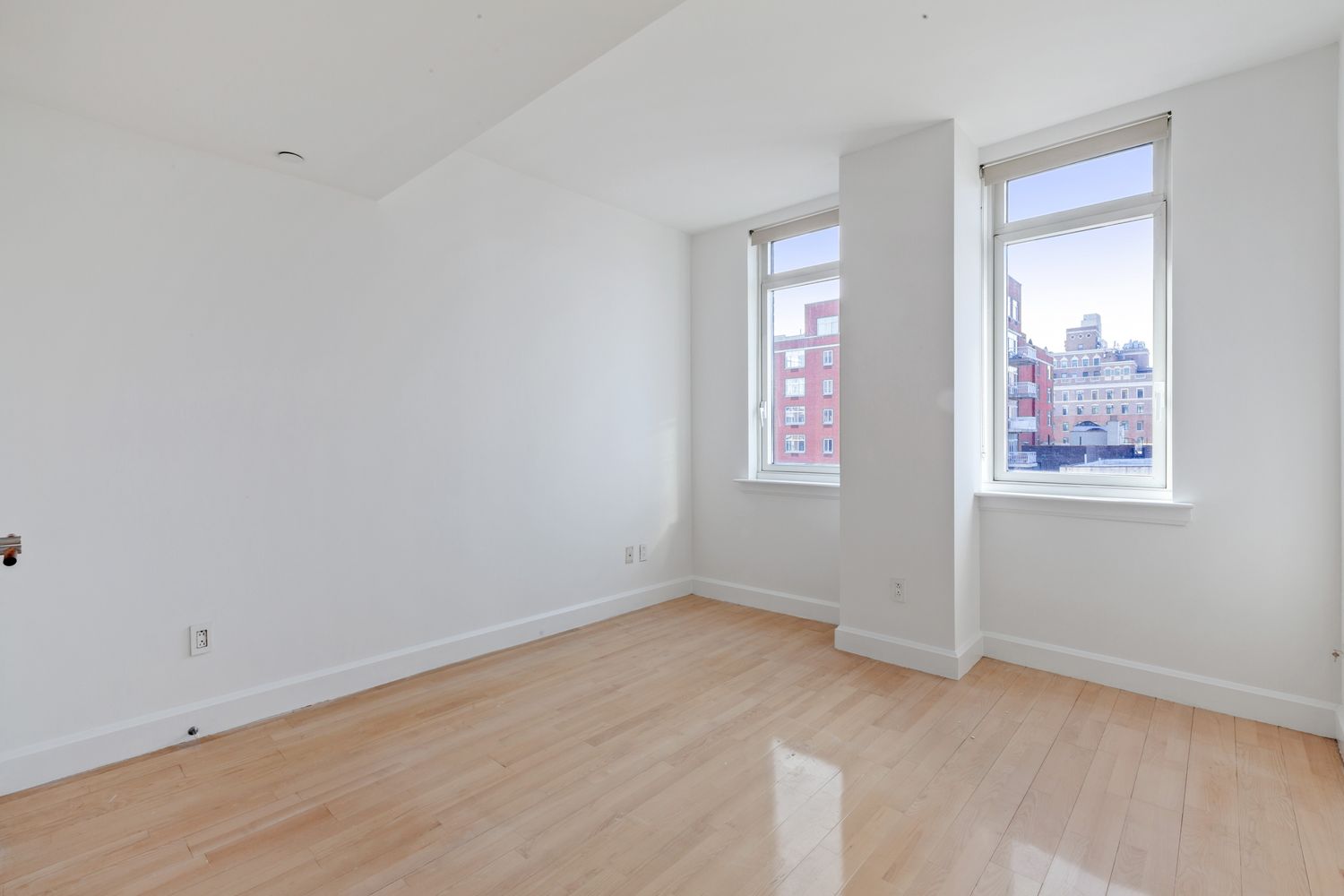 2300 Frederick Douglass Boulevard, Unit 8D Manhattan, NY 10027 - Photo 2 of 11 an empty room with a window