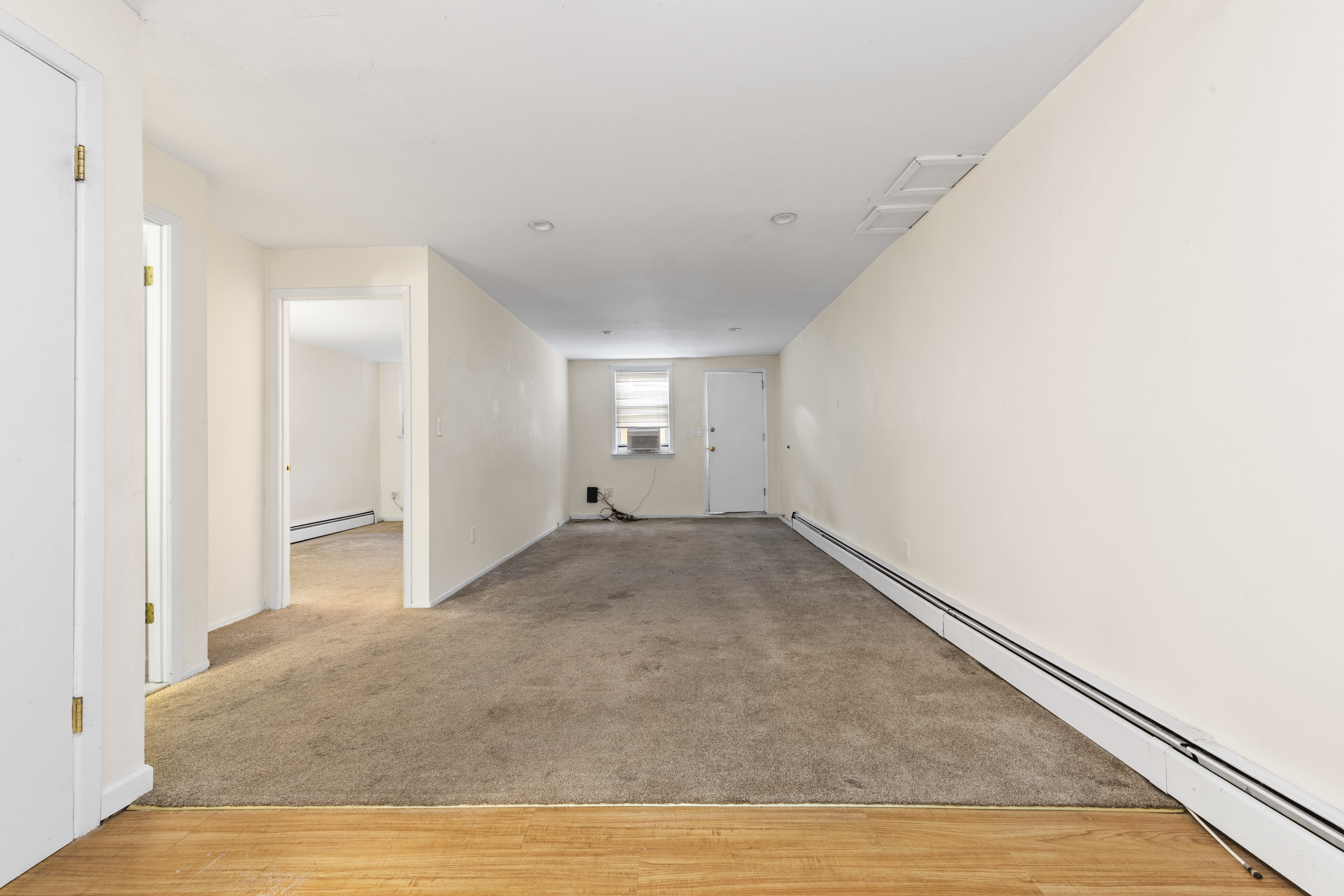 240-47 68th Avenue Queens, NY 11362 - Photo 26 of 39 a view of empty room with wooden floor