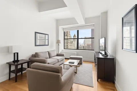 a living room with furniture and windows